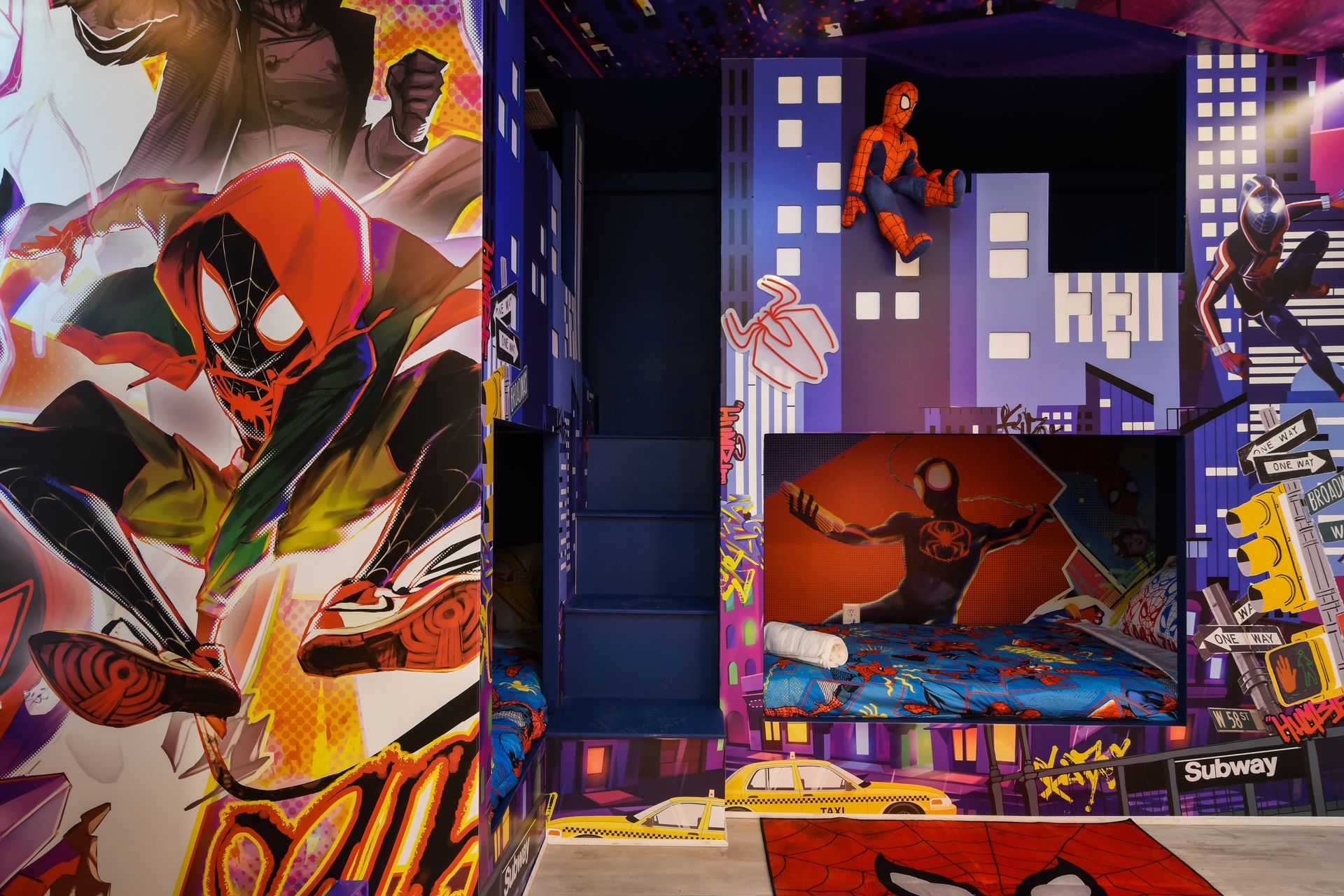 Superhero hideout with bold murals, bunk beds, and Spidey vibes!
