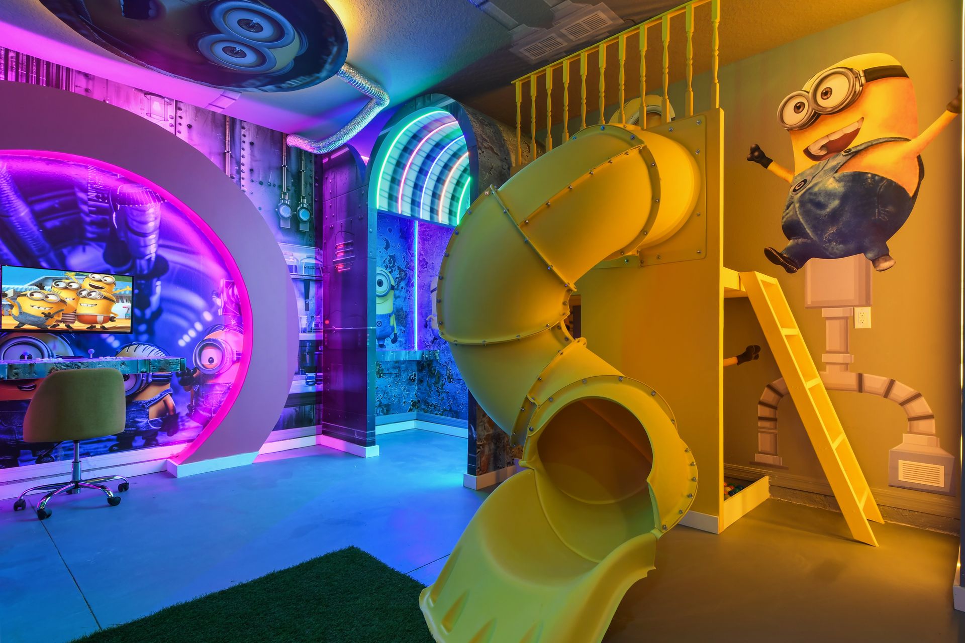 Minion-themed playroom with spiral slide, neon lighting, and fun wall art.