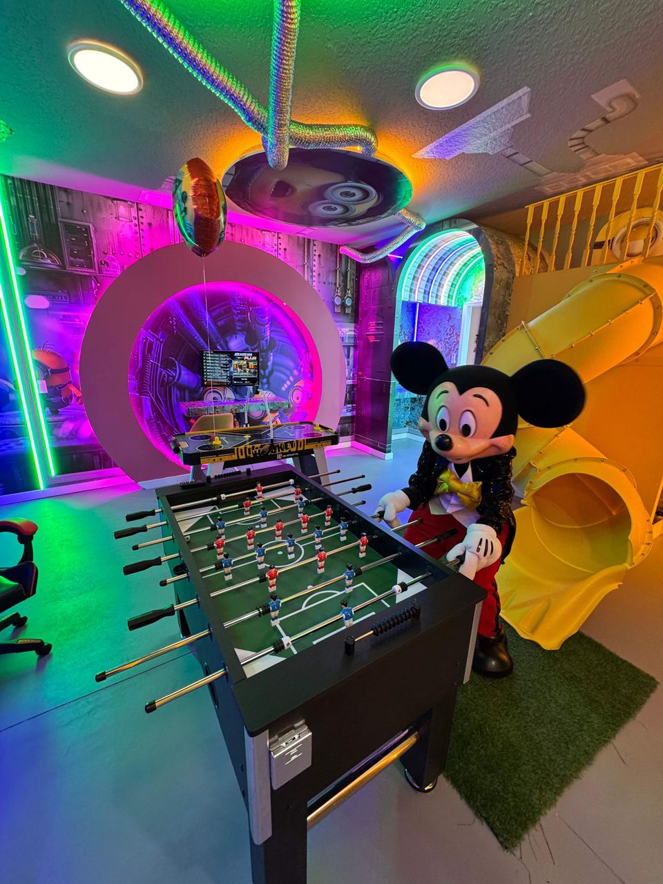 Epic game room with slides, foosball, and immersive themes!