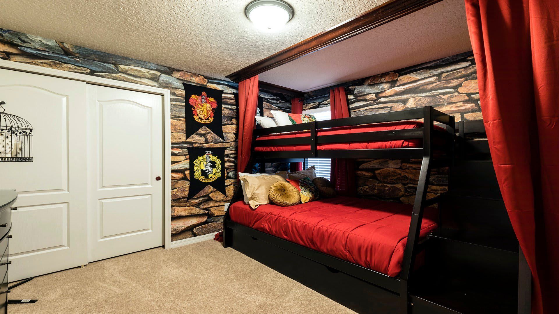 Magical bunk room with castle walls, house banners, and enchanted owl decor for a fun, cozy stay.