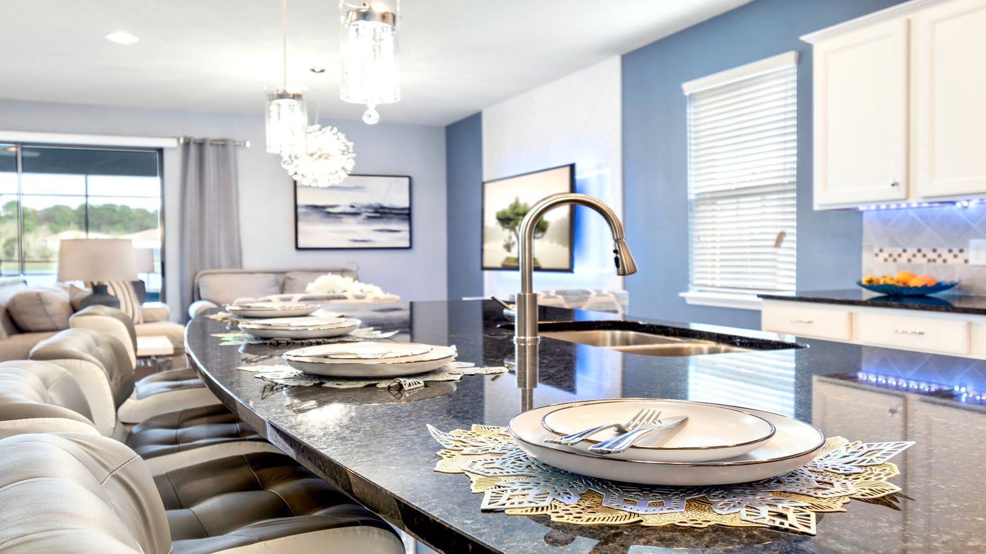Stunning kitchen with granite island, cozy seating, and chic decor. Ready for your next feast!