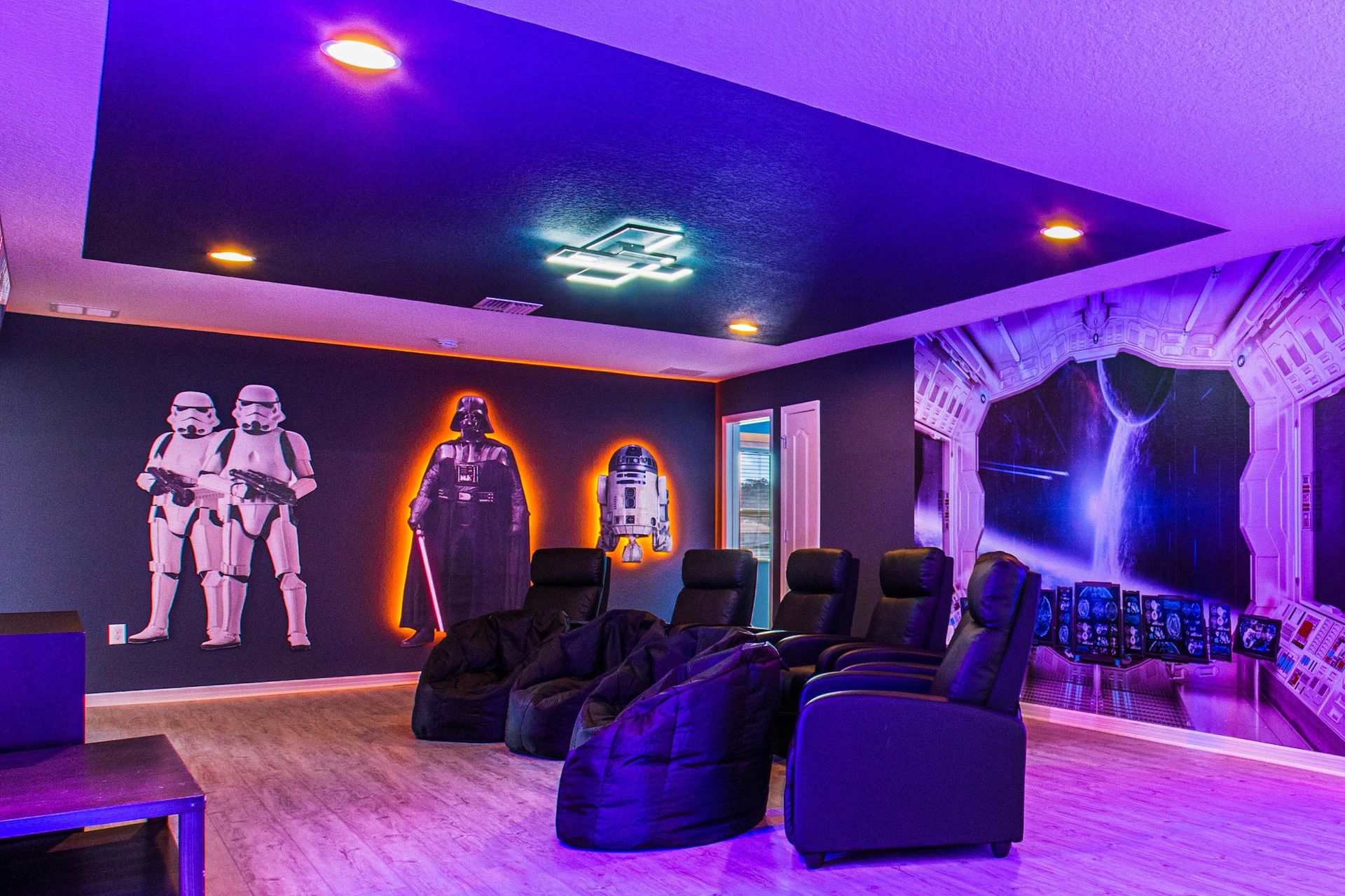 Immersive Star Wars-themed theater with cozy seating and epic neon lighting!