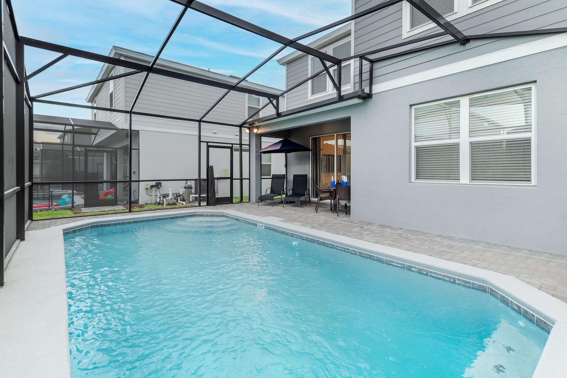 Screened Pool & Spa: Enjoy a private oasis with a screened pool and spa for a serene and refreshing retreat