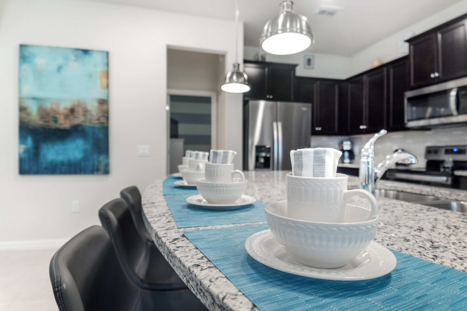 Kitchen: Compact and stylish with a mini breakfast bar, offering a cozy space for quick and casual dining