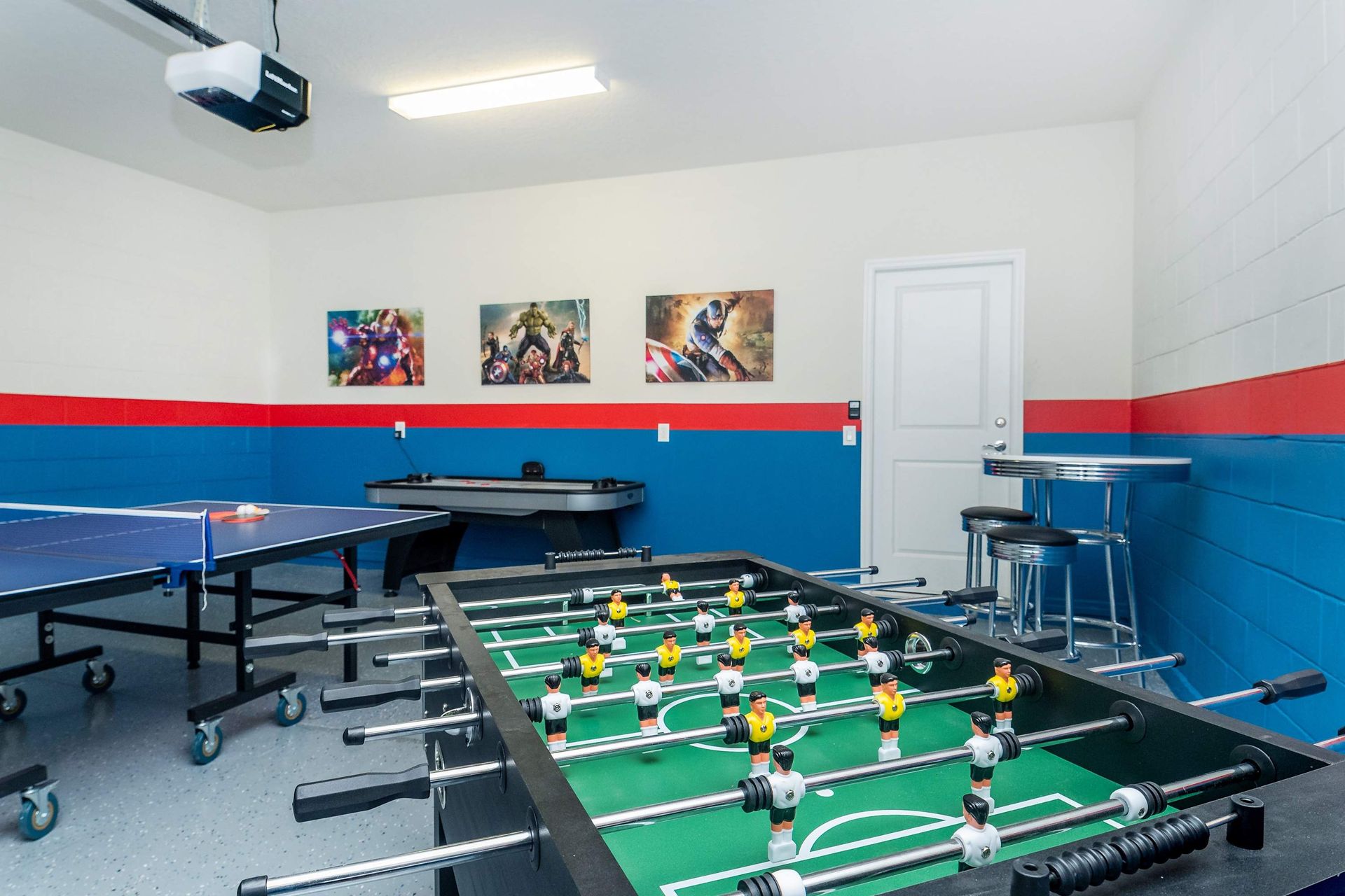 Game Room: Exciting space with a table tennis and foosball setup for endless entertainment and friendly competition