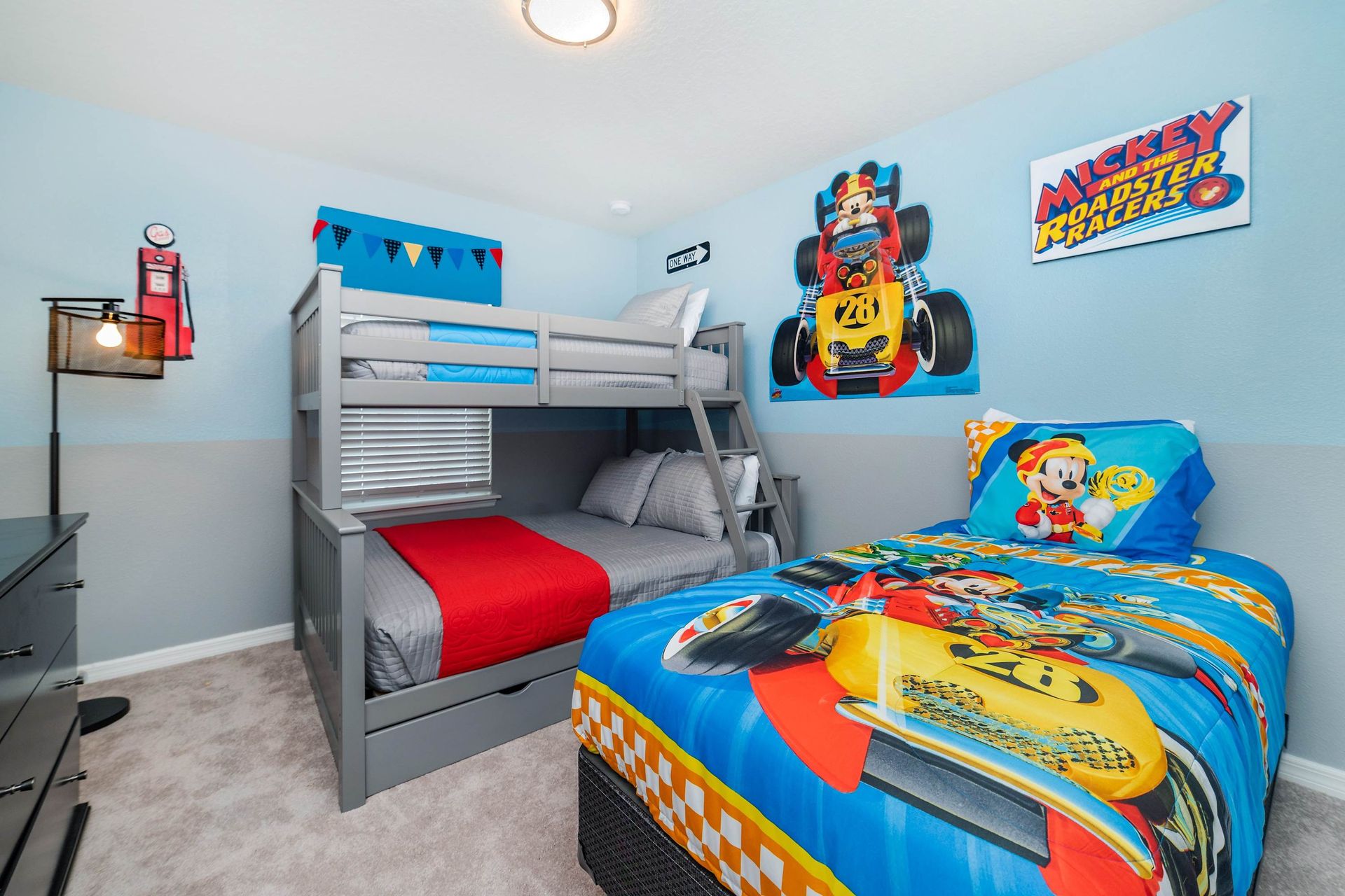 Dive into Mickey Mouse magic with a bunk bed and a twin bed, creating a whimsical and cozy atmosphere for a delightful stay.