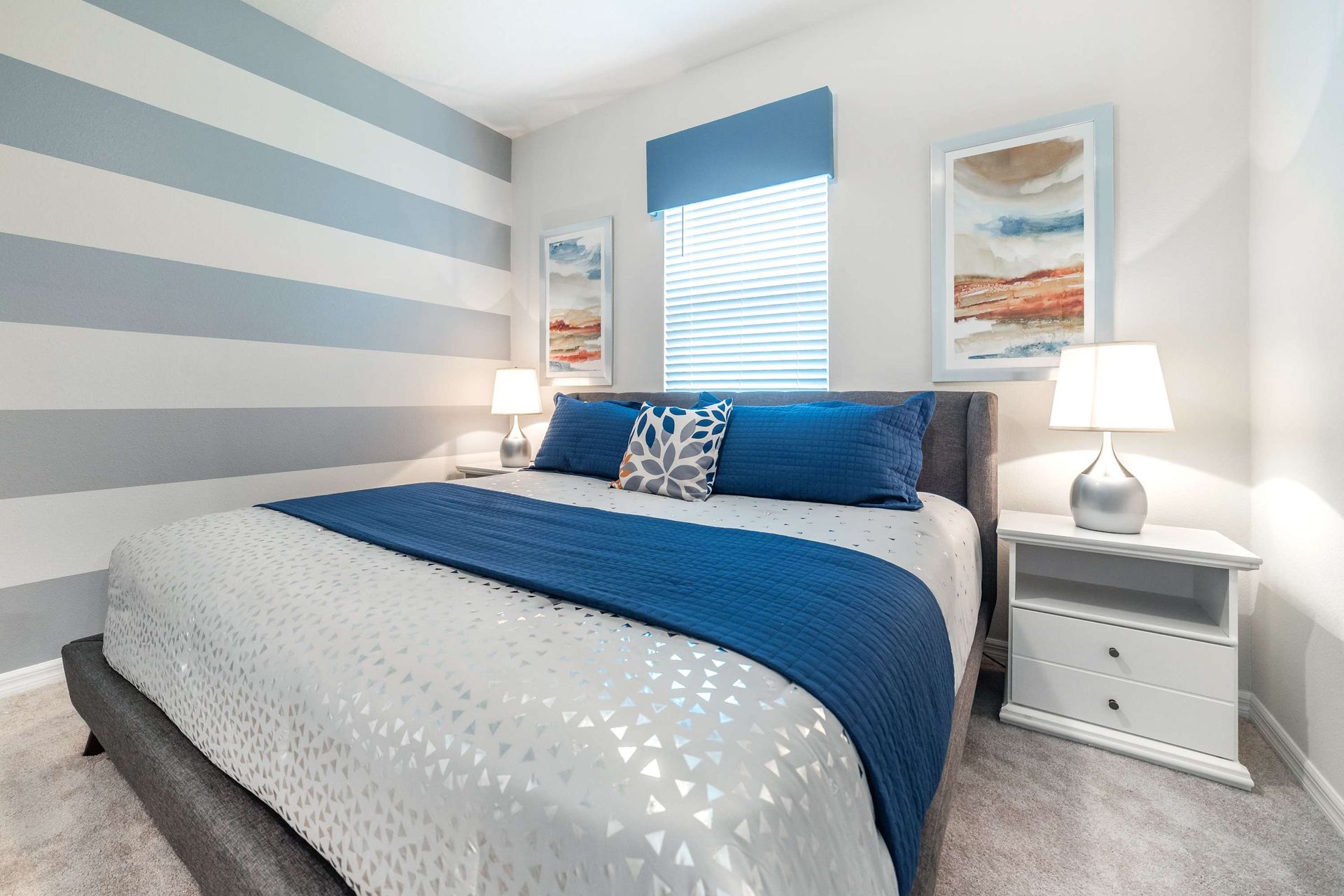 Queen-sized comfort with a TV, offering a cozy and entertainment-ready haven.