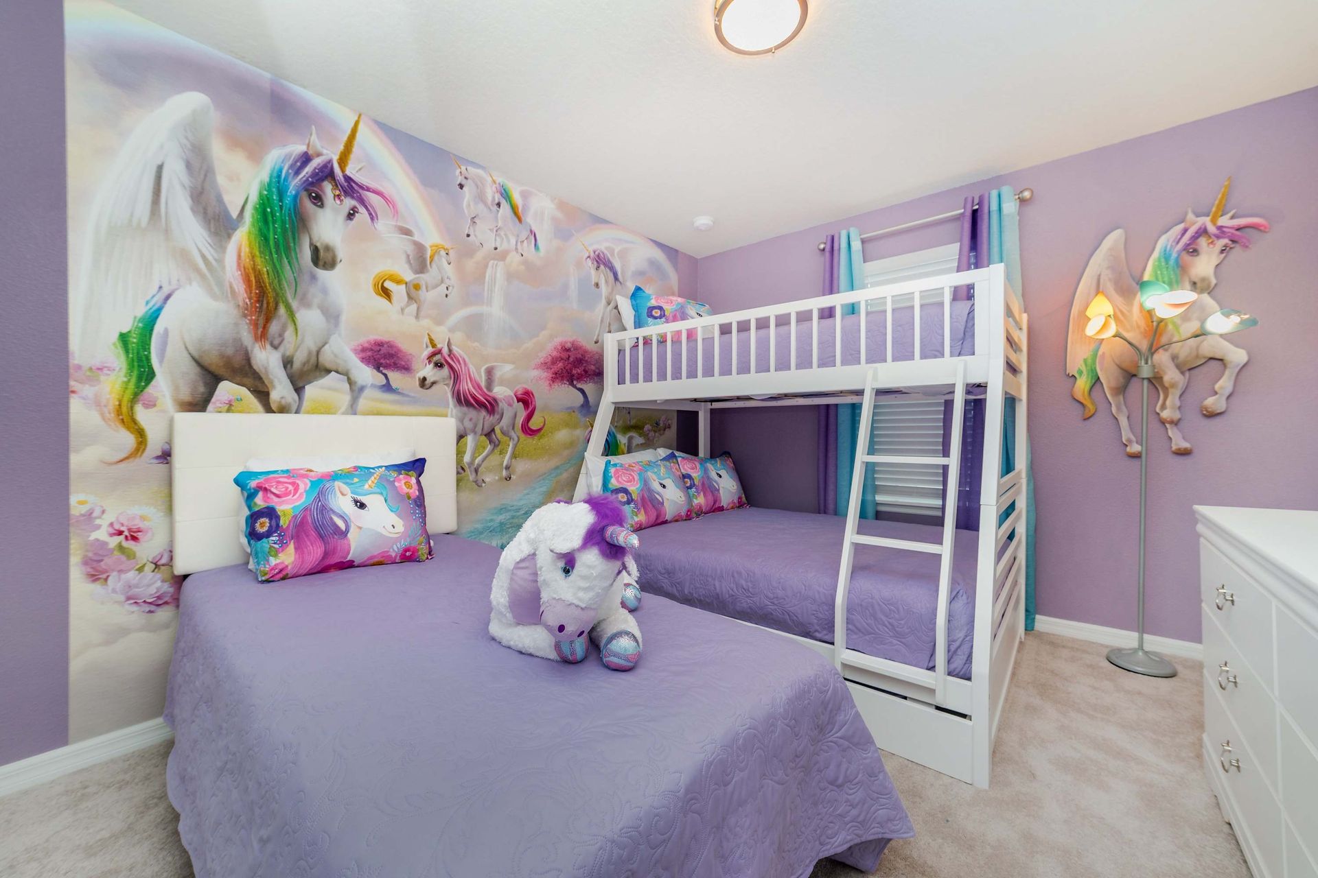 Immerse in enchantment with a unicorn-inspired room, featuring a bunk bed and a twin bed for a magical and cozy stay.