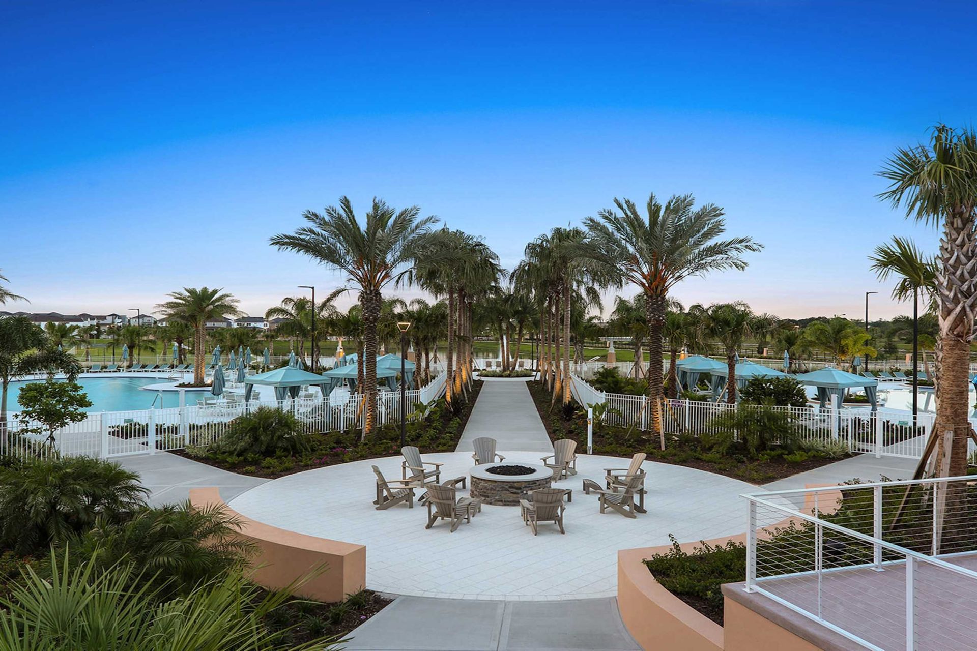 Relax by the fire pit, stroll palm-lined paths, and unwind at the resort pool.
