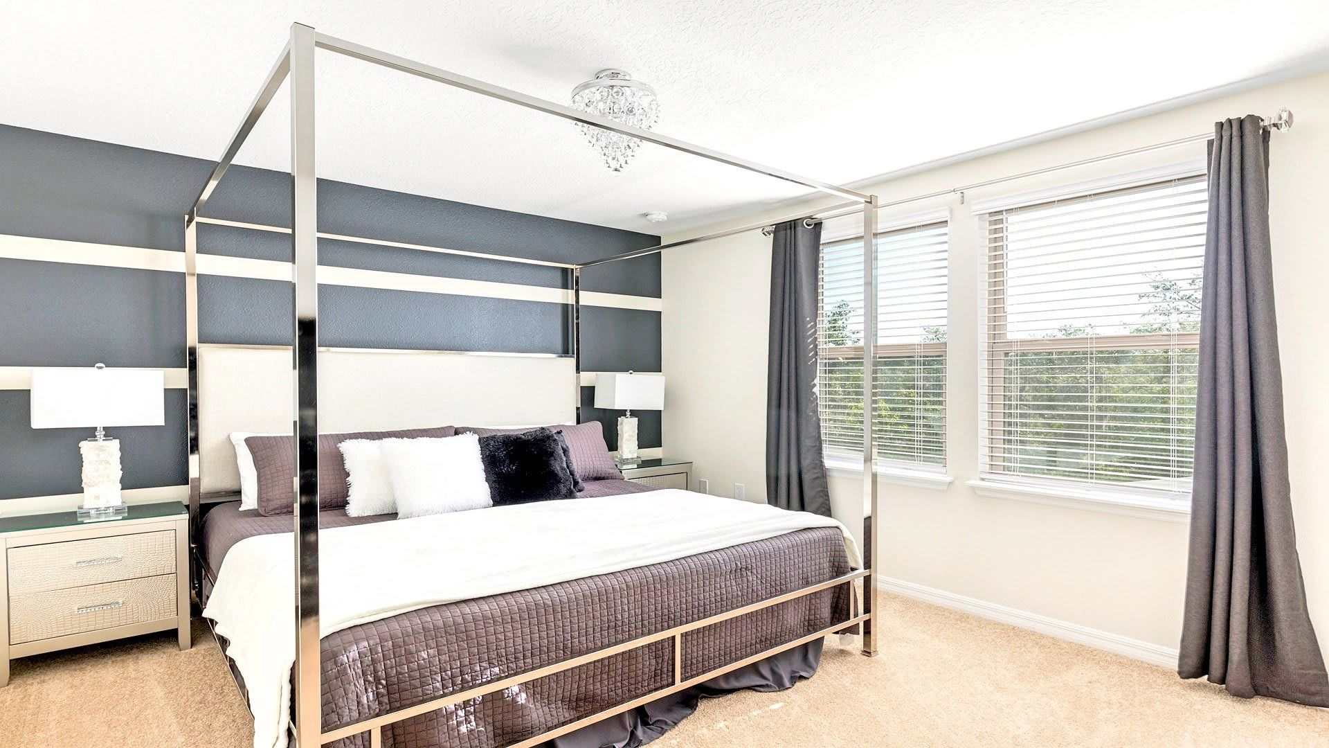 Luxurious master suite with a king-sized bed and plush furnishings