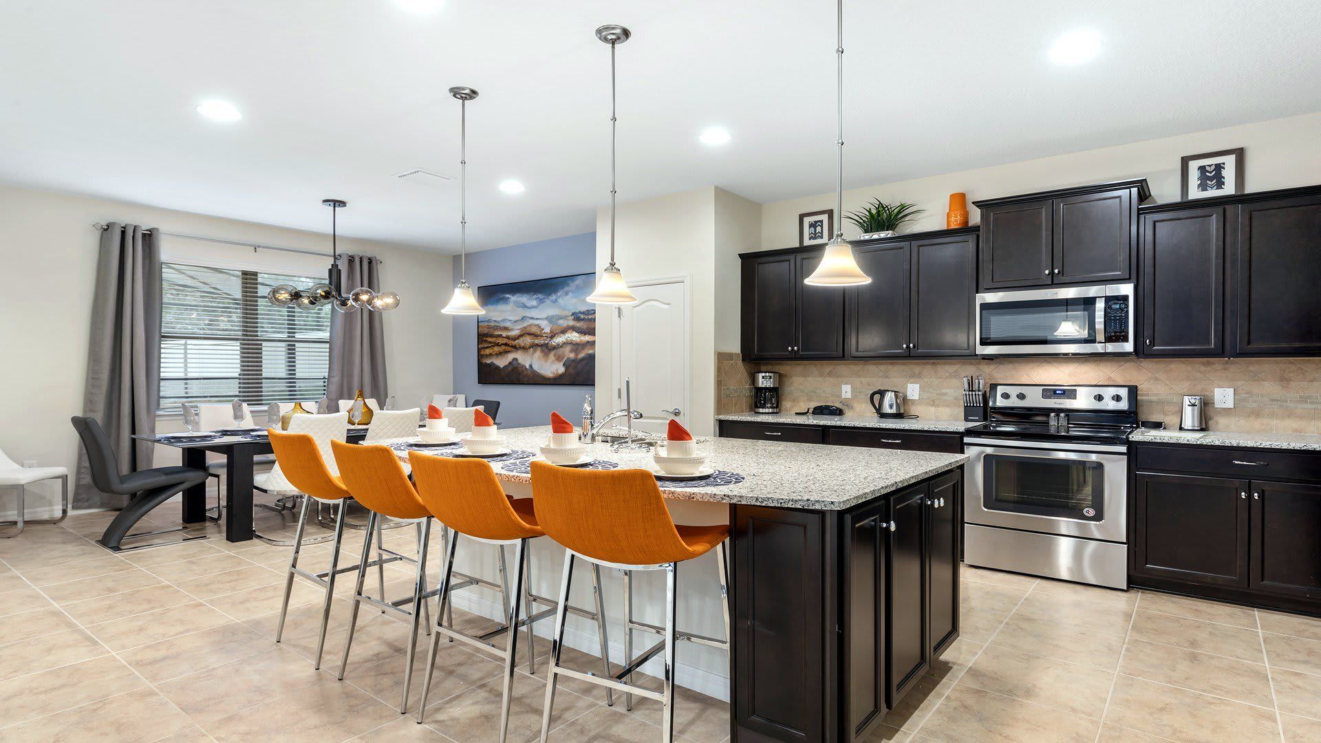 Kitchen: Compact and stylish with a mini breakfast bar, offering a cozy space for quick and casual dining