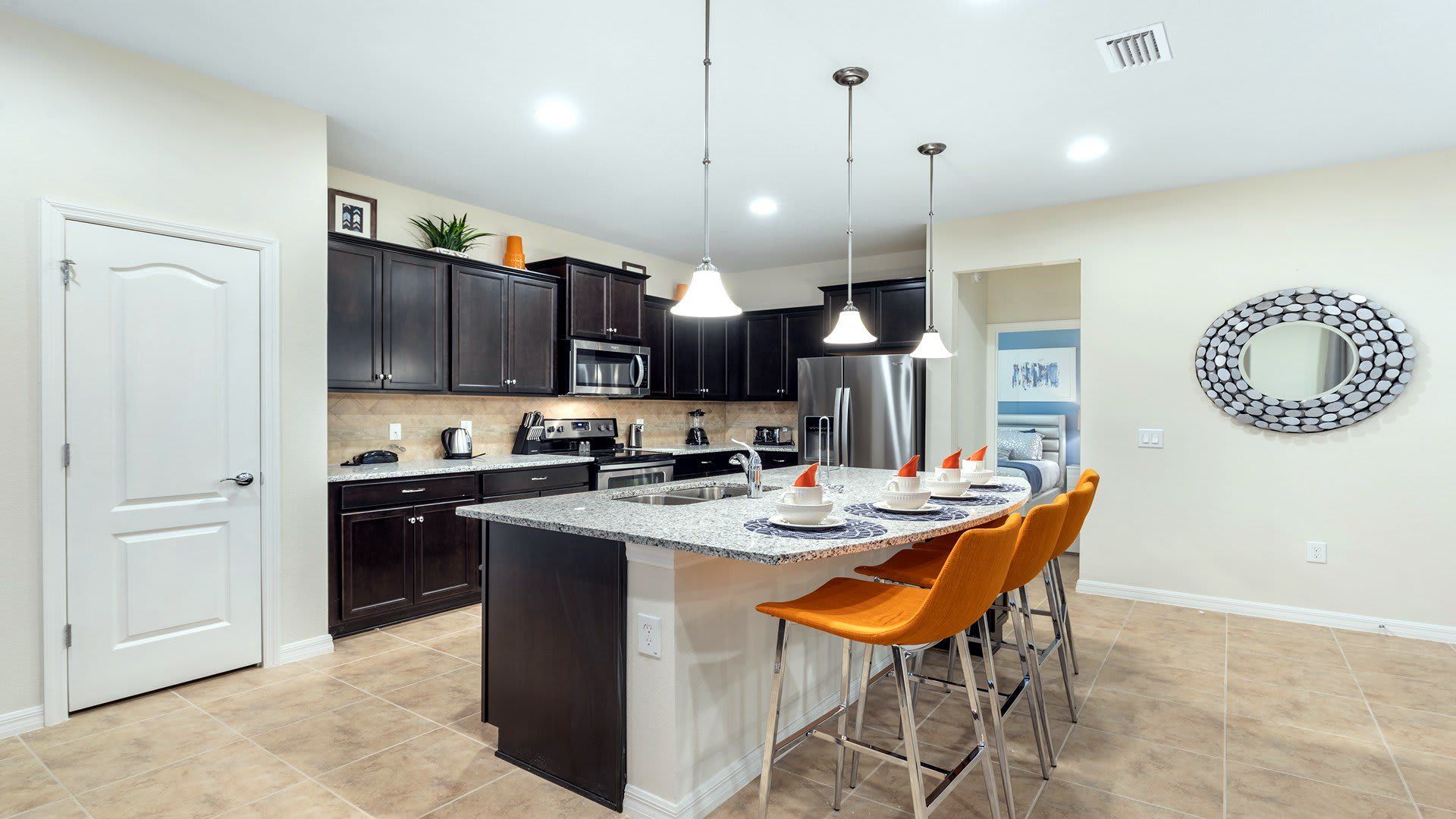 Kitchen: Compact and stylish with a mini breakfast bar, offering a cozy space for quick and casual dining