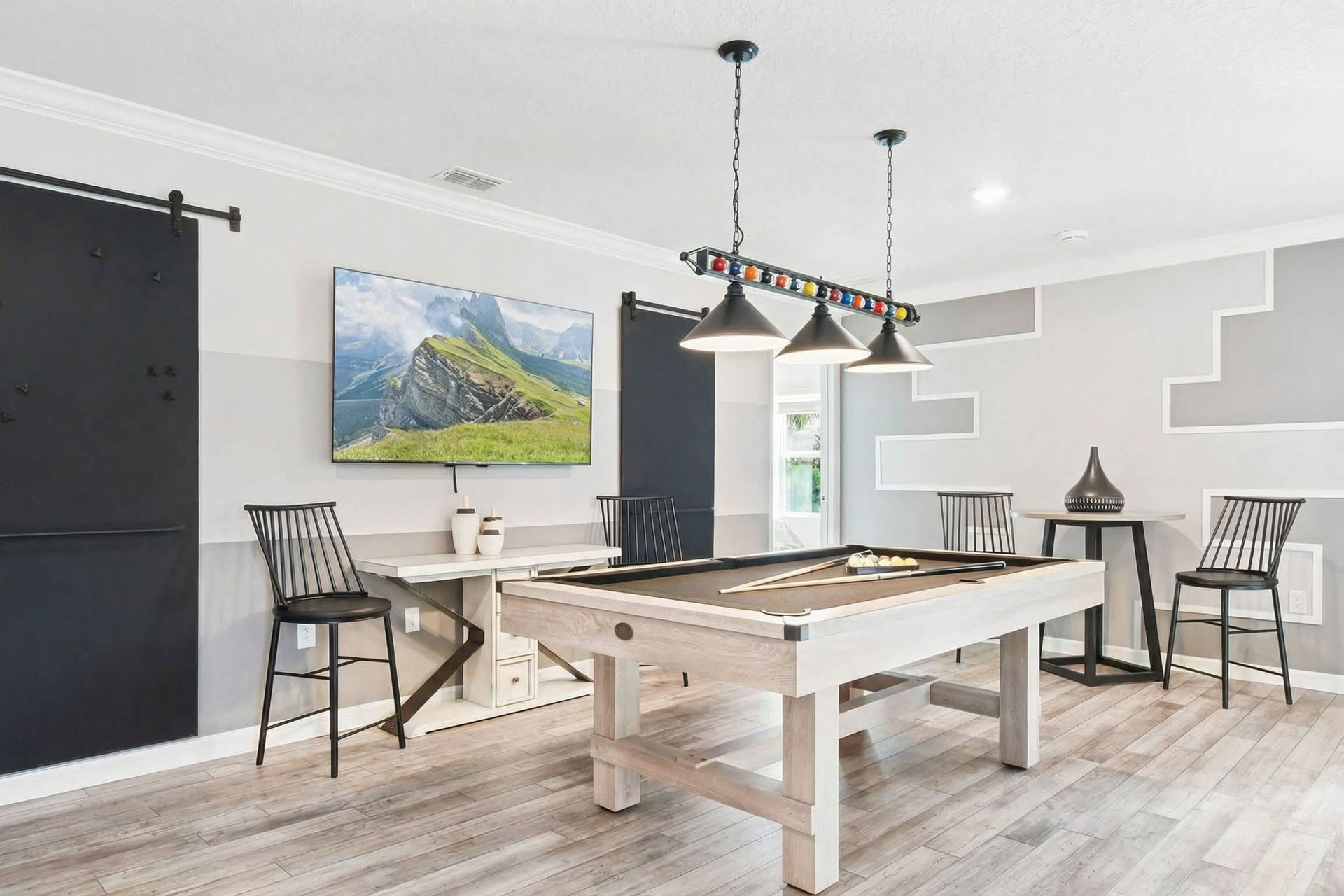 Enjoy your time in the second-floor living, which includes a pool table