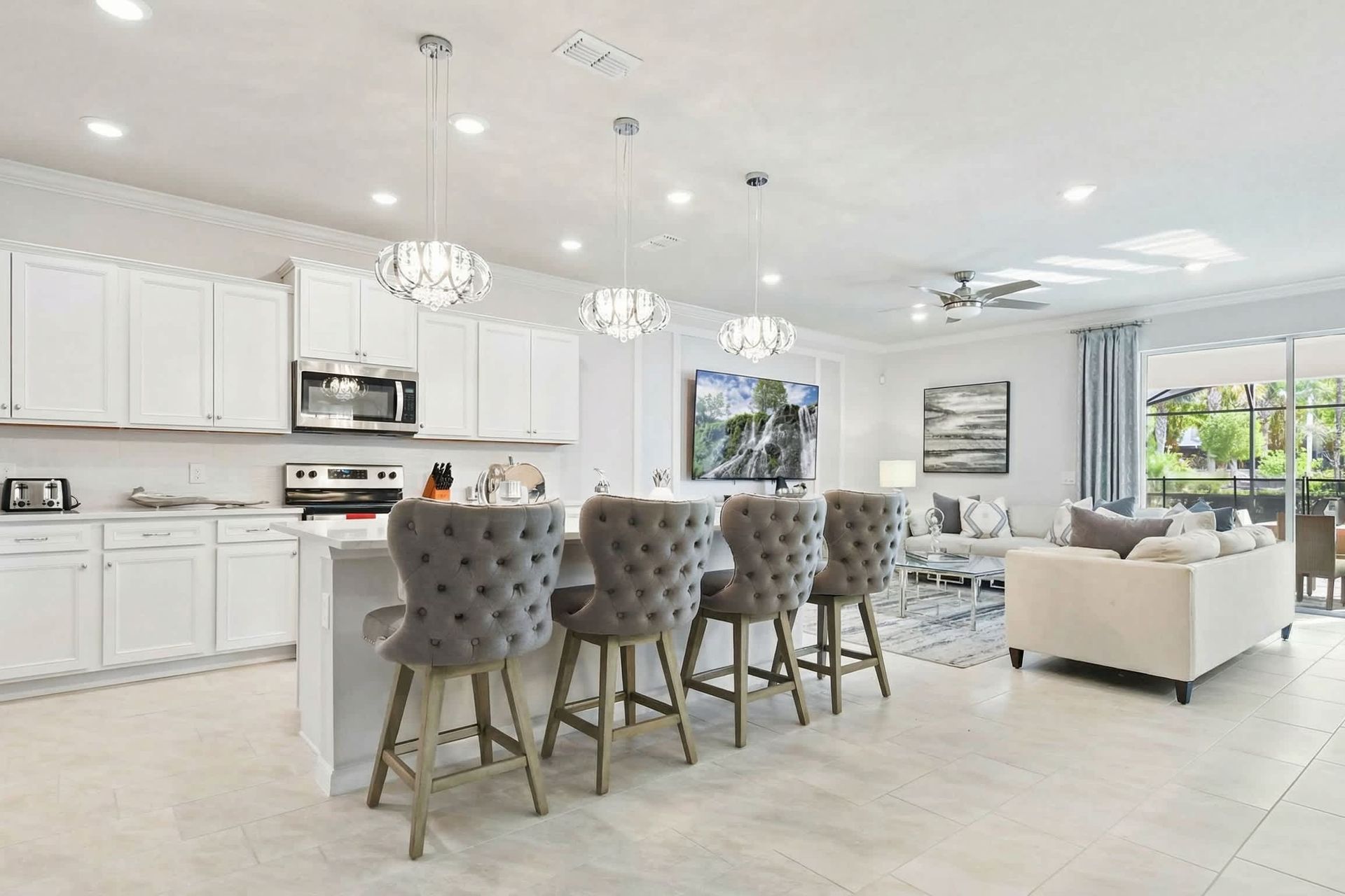 Sip on your favorite cocktails at our stylish kitchen bar, offering you a delightful way to unwind and relax.