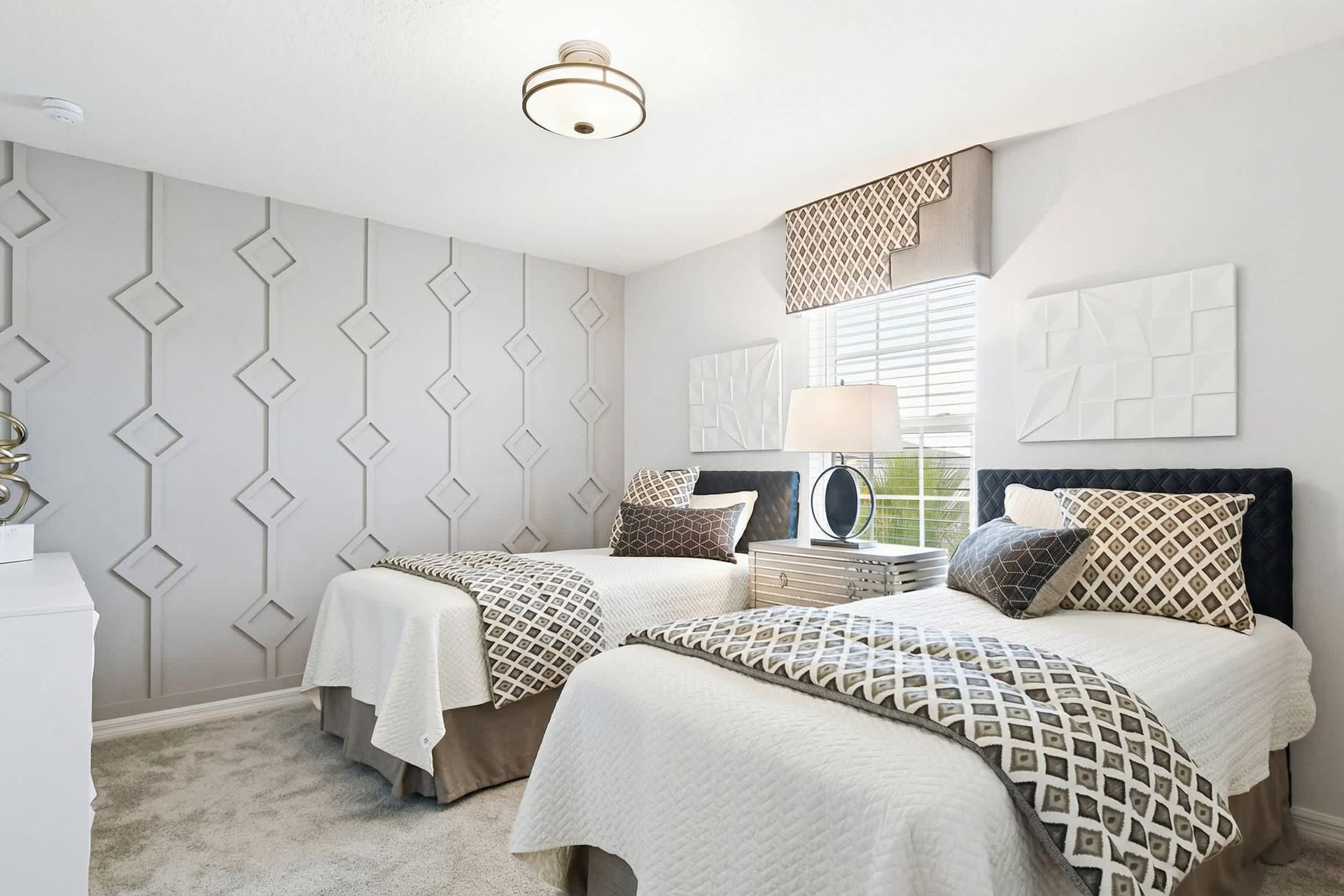Modern twin bedroom with geometric accents, stylish decor, and a cozy, elegant feel!