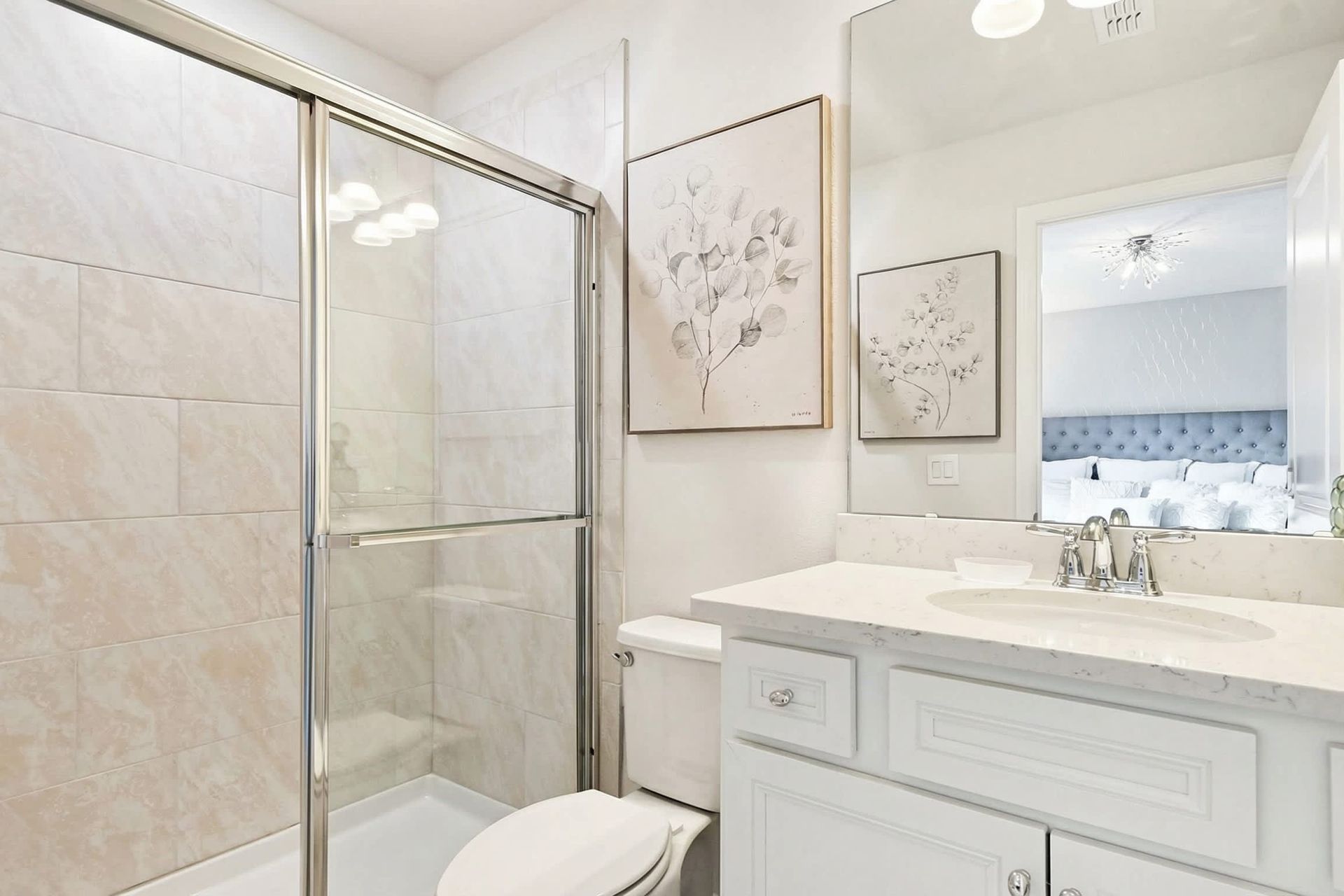 Bright and elegant bathroom with a sleek vanity, glass shower, and modern finishes!