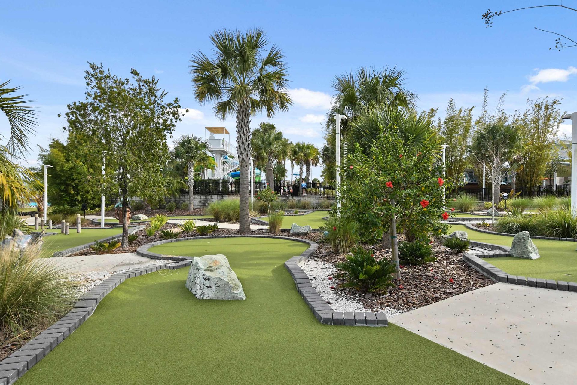 Tropical mini-golf retreat! Lush greens, palm trees & fun—perfect getaway!