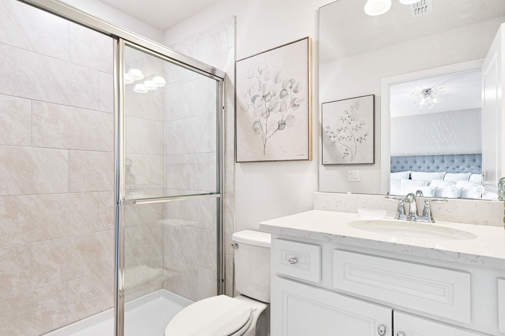 Bright and elegant bathroom with a sleek vanity, glass shower, and modern finishes!