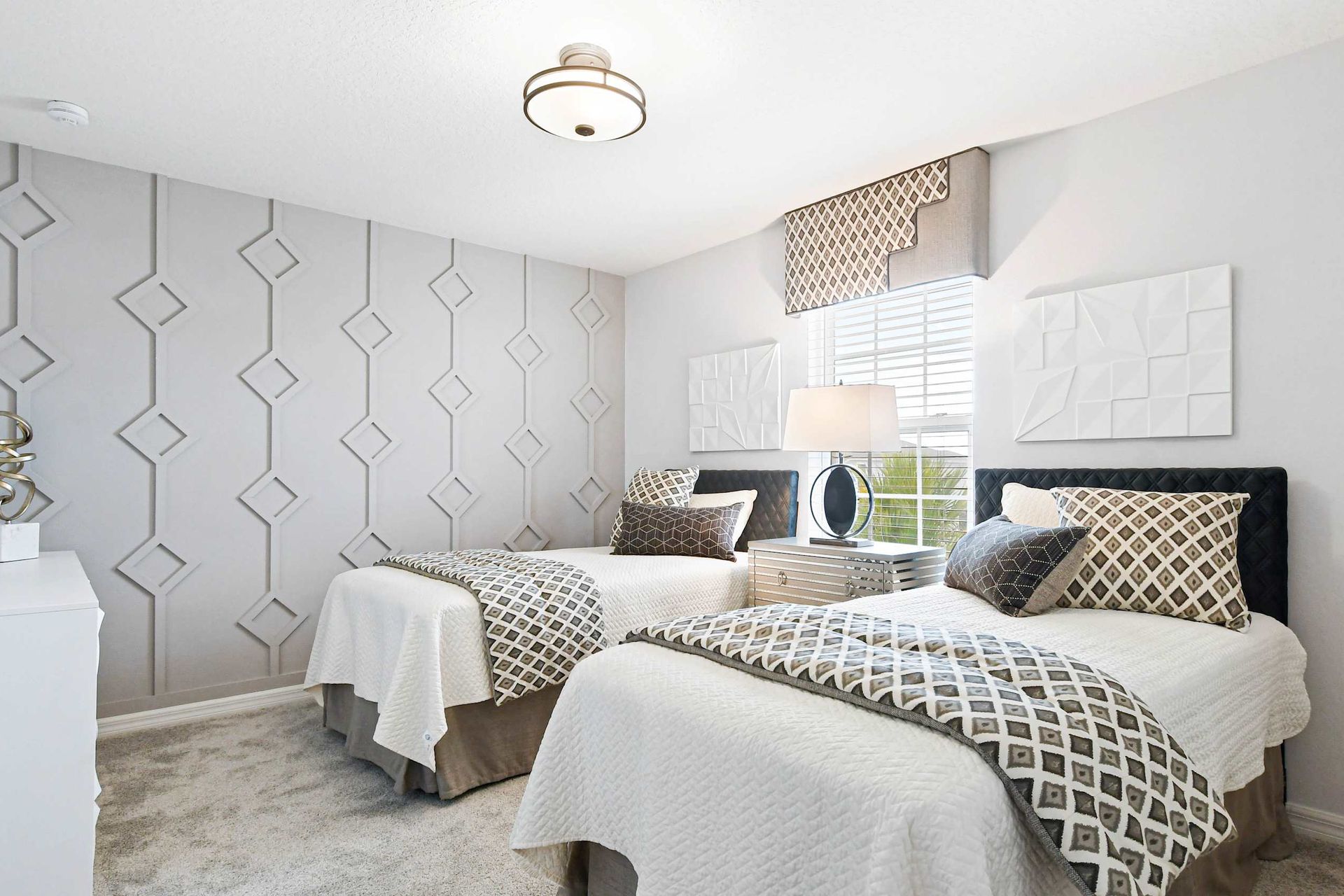 Modern twin bedroom with geometric accents, stylish decor, and a cozy, elegant feel!