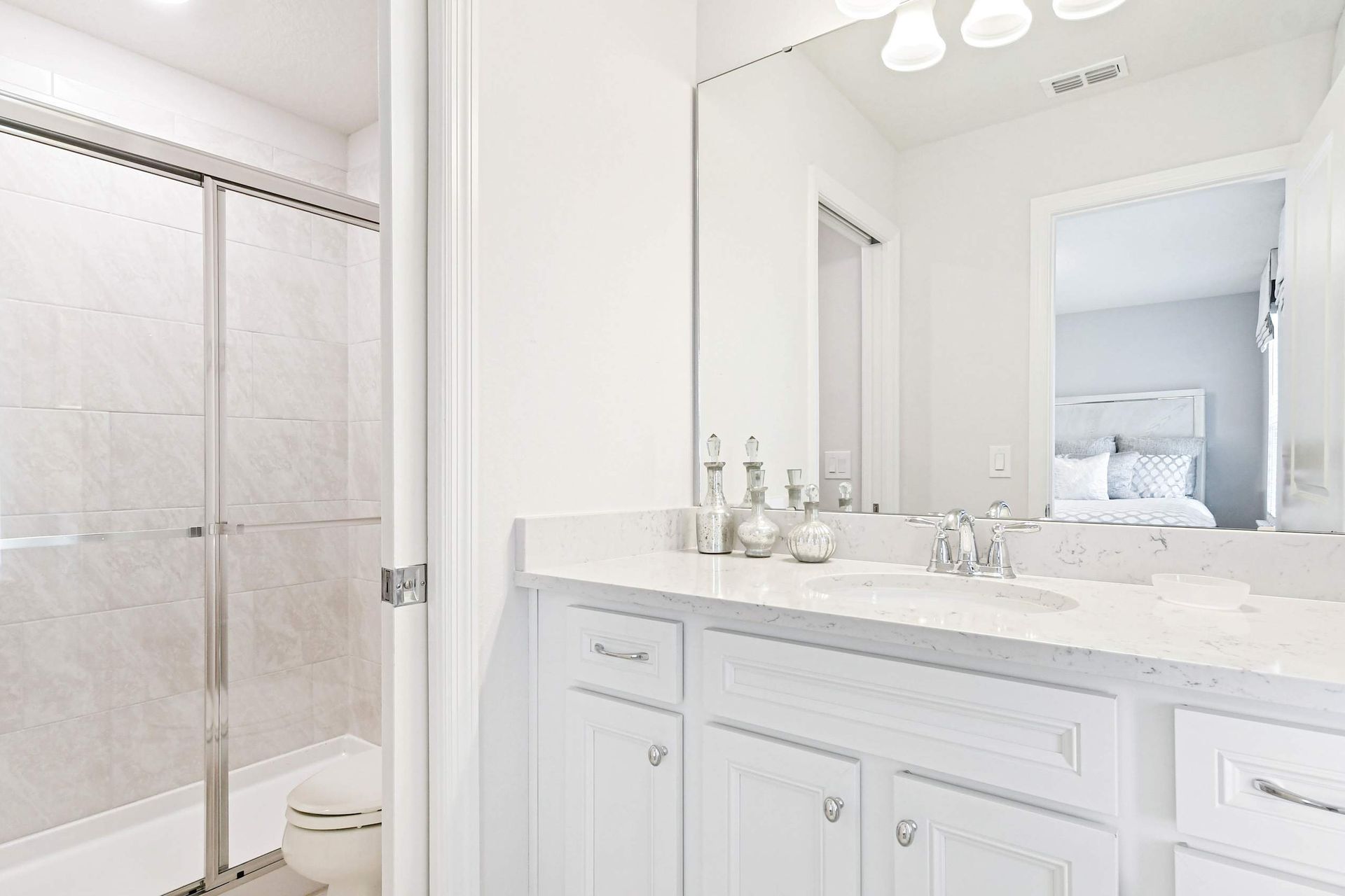 Bright and elegant bathroom with a sleek vanity, glass shower, and modern finishes!
