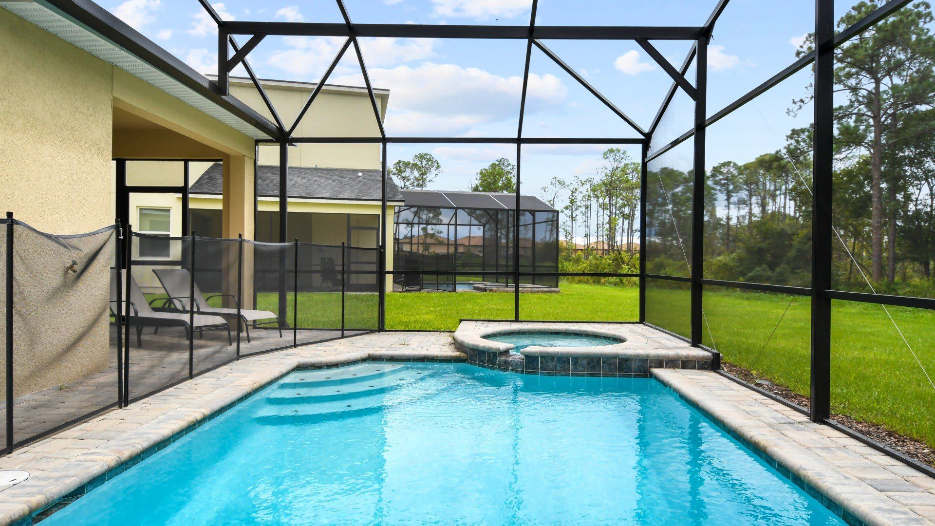 Screened-in private pool and spa with serene nature views—relax and unwind! 