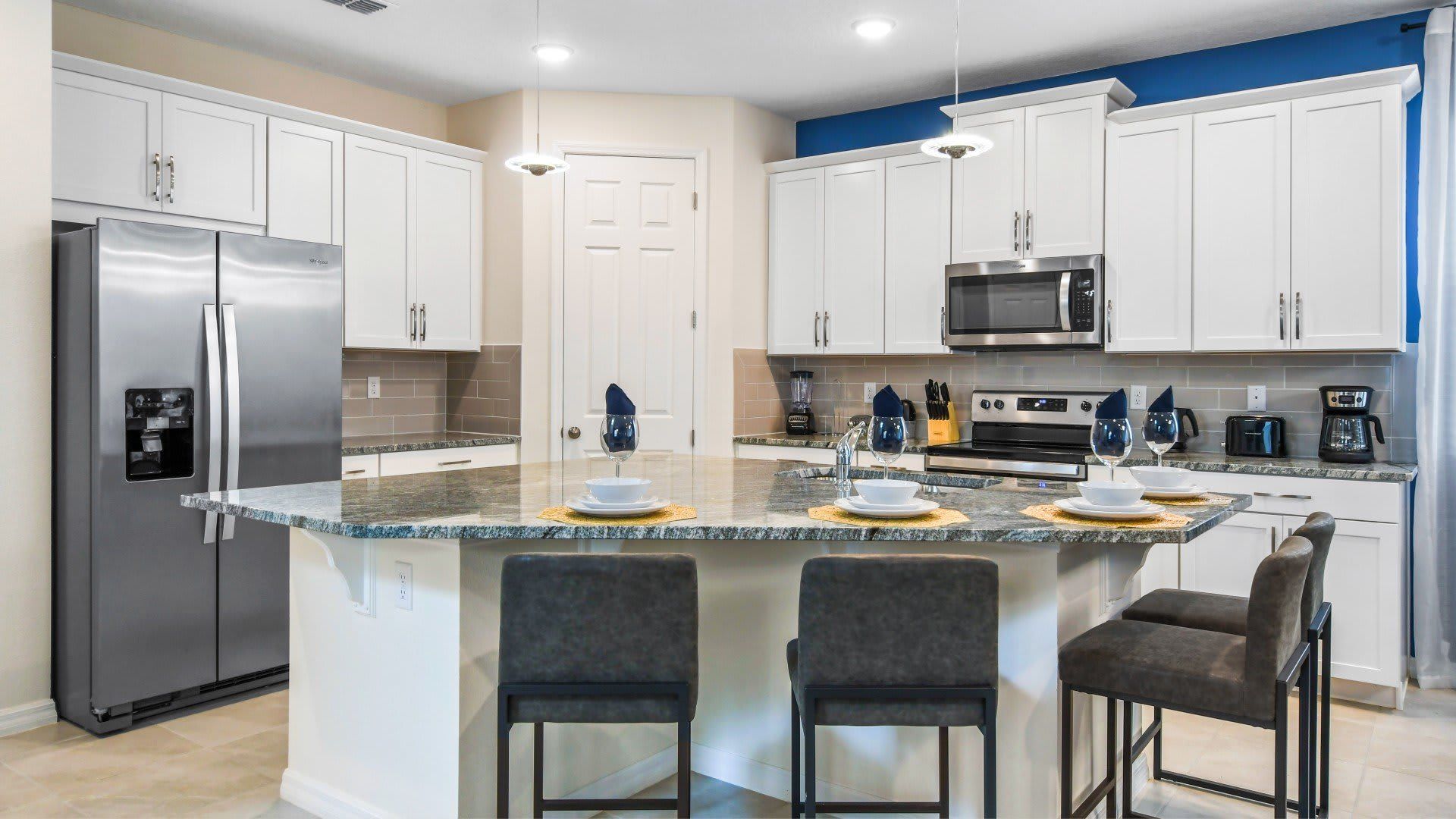 Sit up at the breakfast bar and keep the chef company