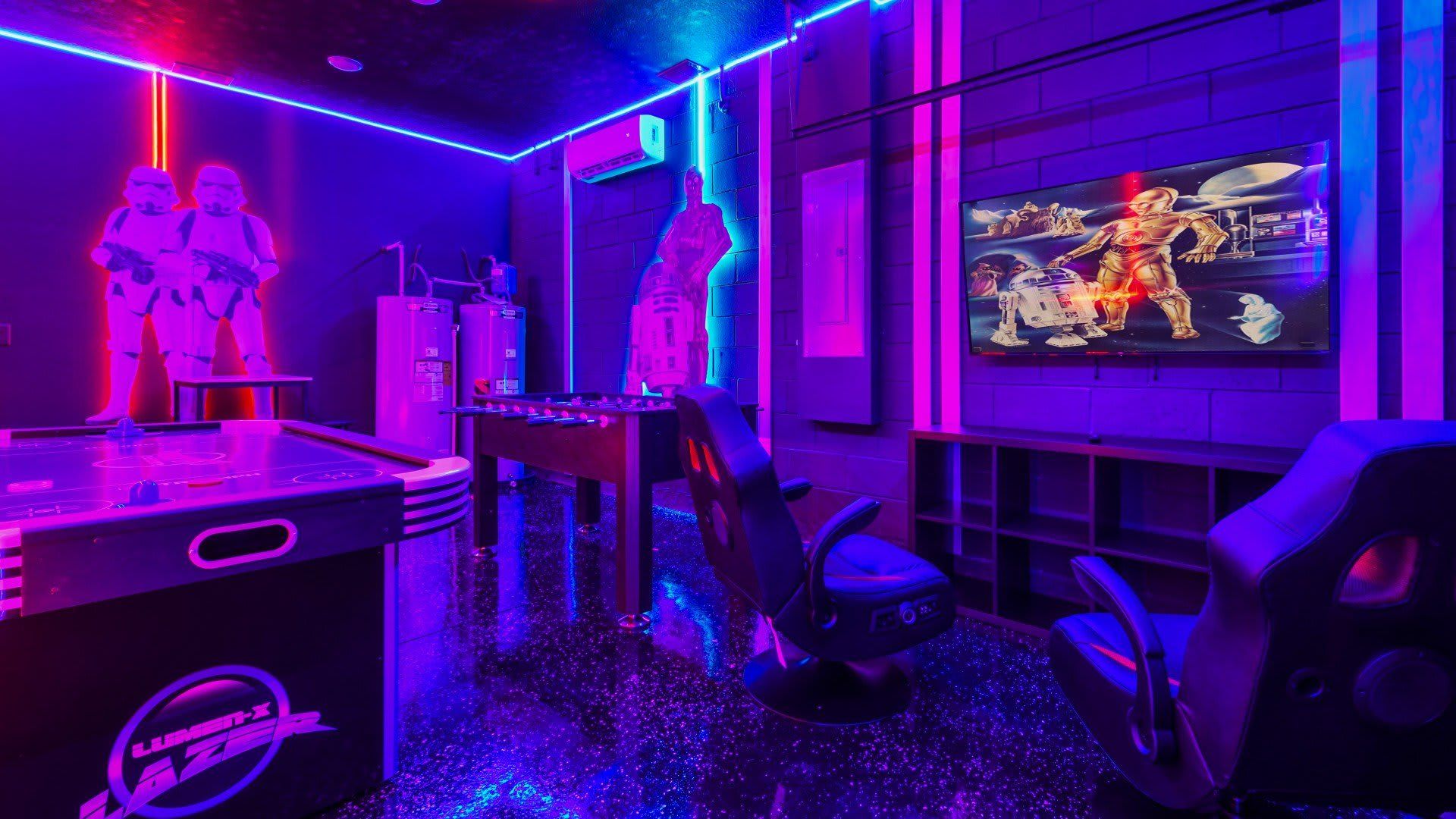 The game room is stylishly furnished with Star Wars theme with cool lights