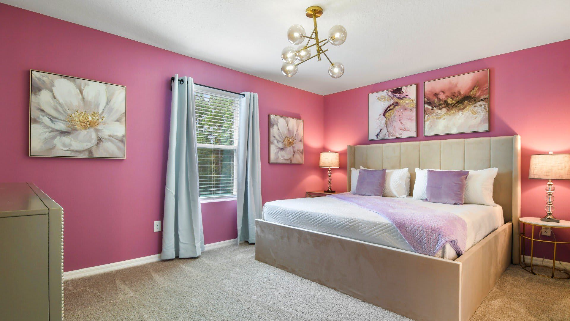 Chic pink bedroom with elegant decor, plush bedding, and a luxurious vibe!