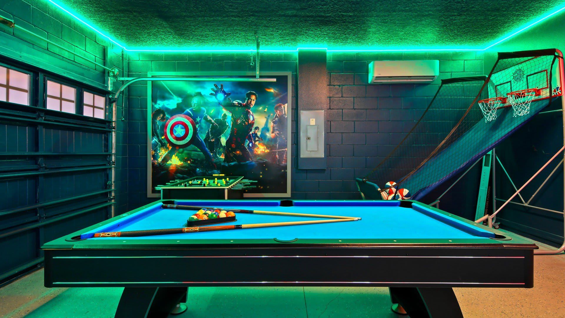 Avengers-themed game room with pool, foosball, basketball & epic LED lighting!
