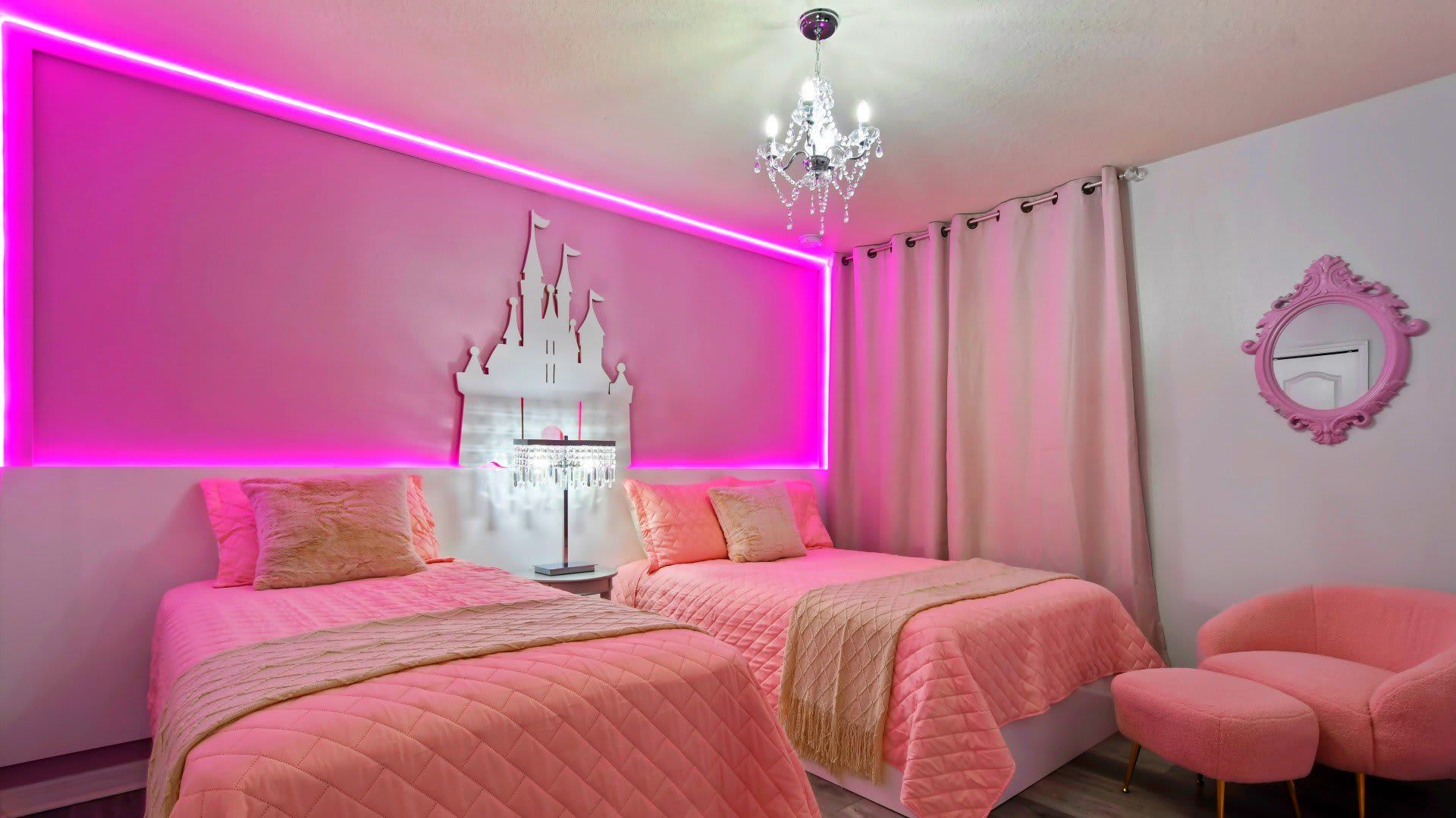 Dreamy princess-themed bedroom with pink decor, LED lighting & a sparkling chandelier!