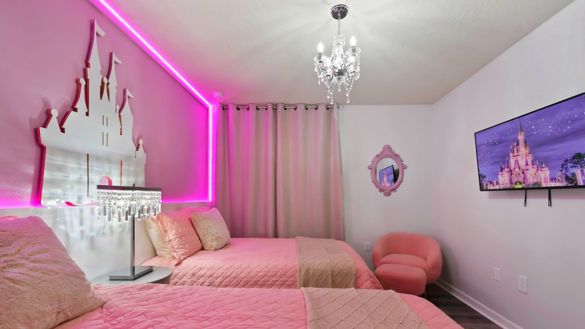 Magical princess-themed room with pink decor, LED lighting & a sparkling chandelier!