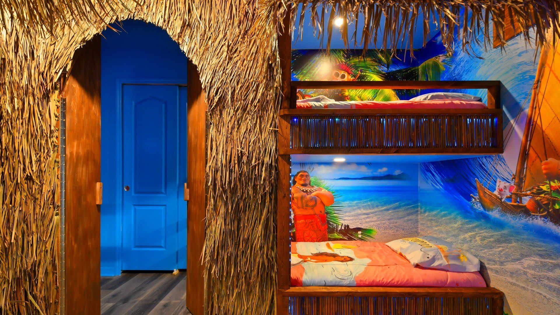 Tropical Moana-themed bunk room with island vibes, vibrant decor & cozy beds!