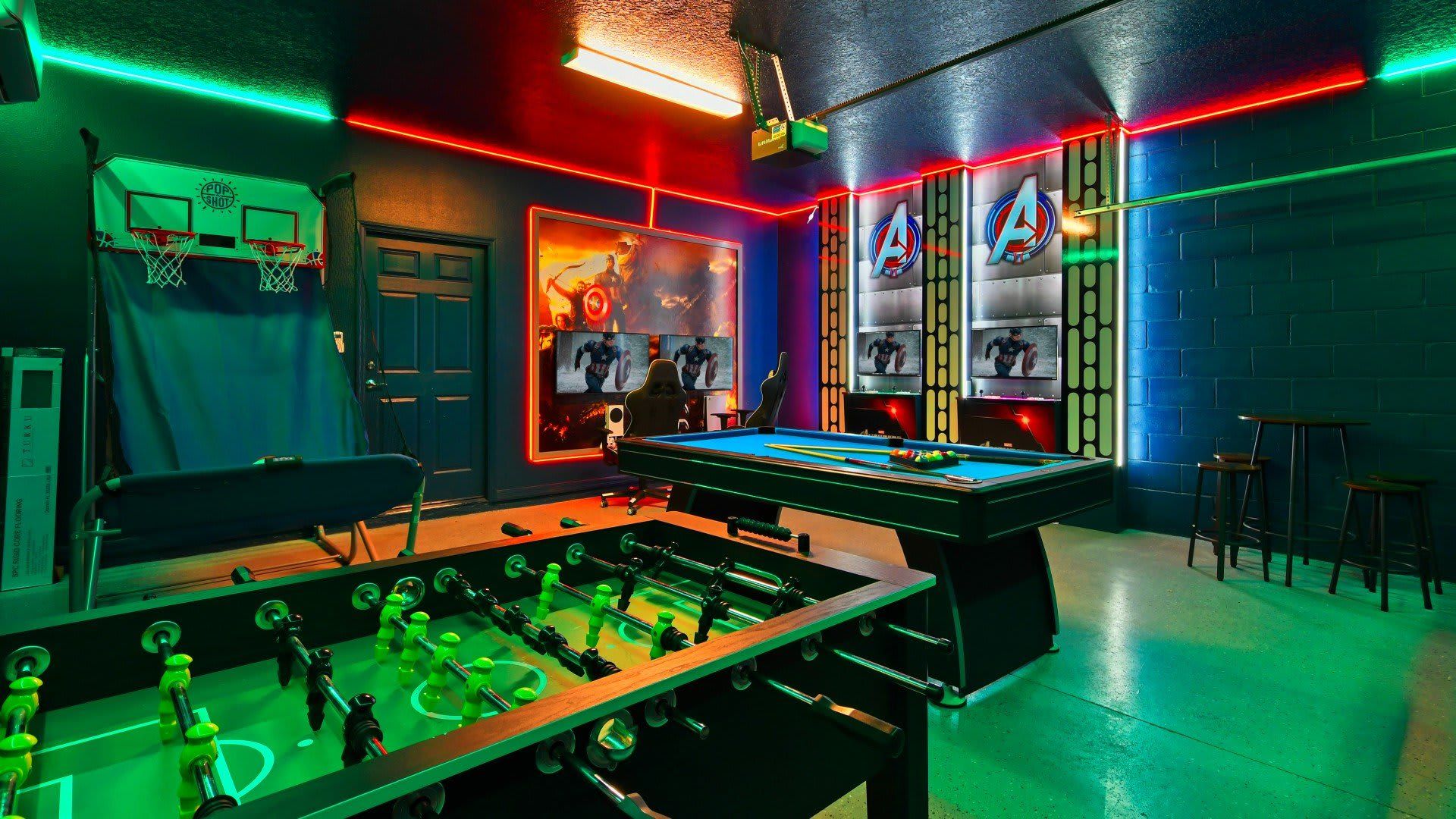 Ultimate Avengers-themed game room with arcade, pool, foosball & epic lighting!