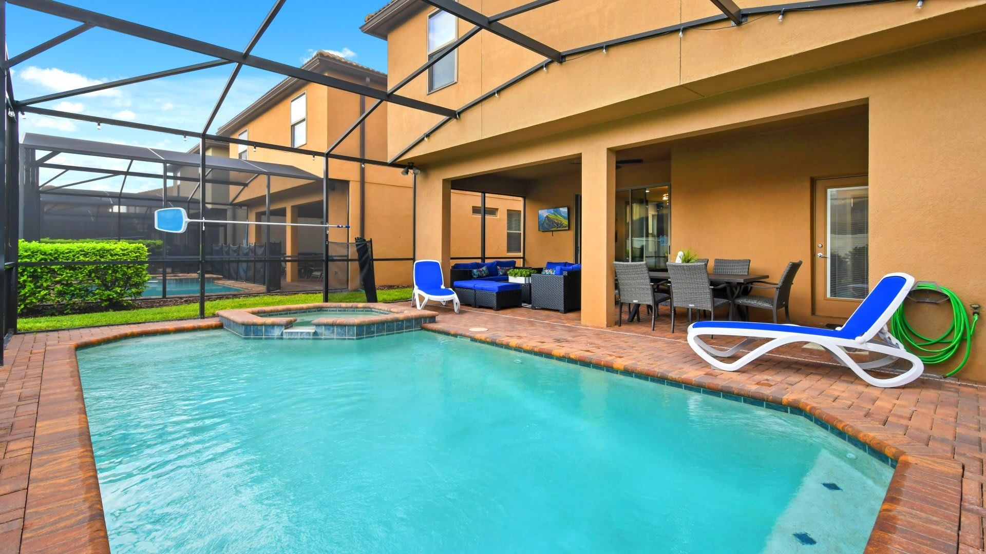 Luxury screened-in pool & spa with lounge seating, dining area & ultimate relaxation!