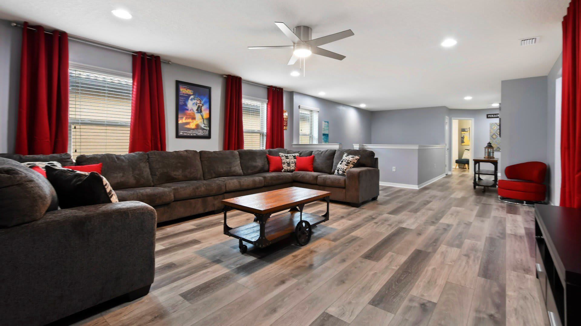 Spacious movie-themed loft with cozy seating, stylish decor & entertainment vibes!