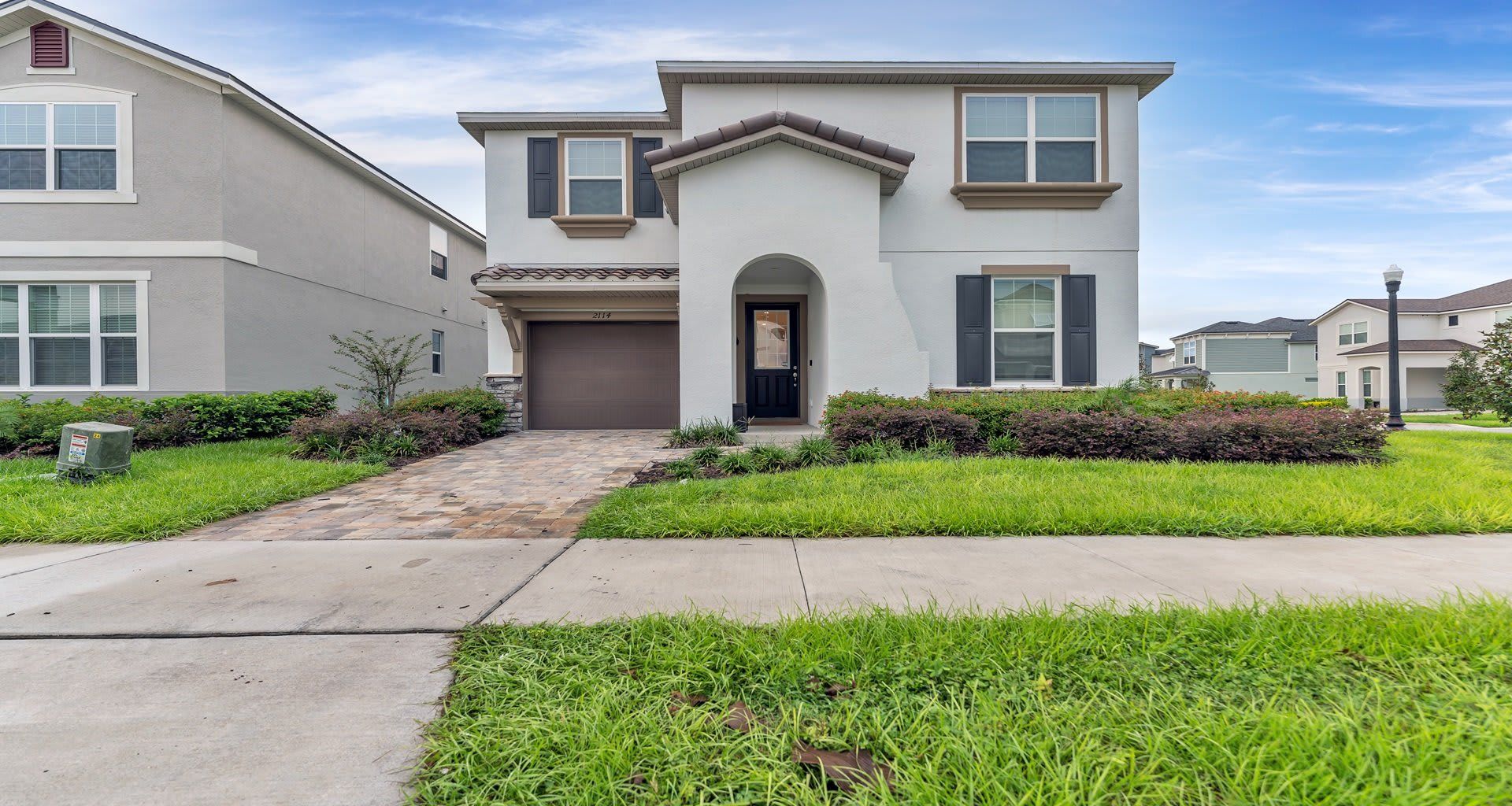 Modern and stylish 2-story home with lush landscaping in a beautiful neighborhood! 