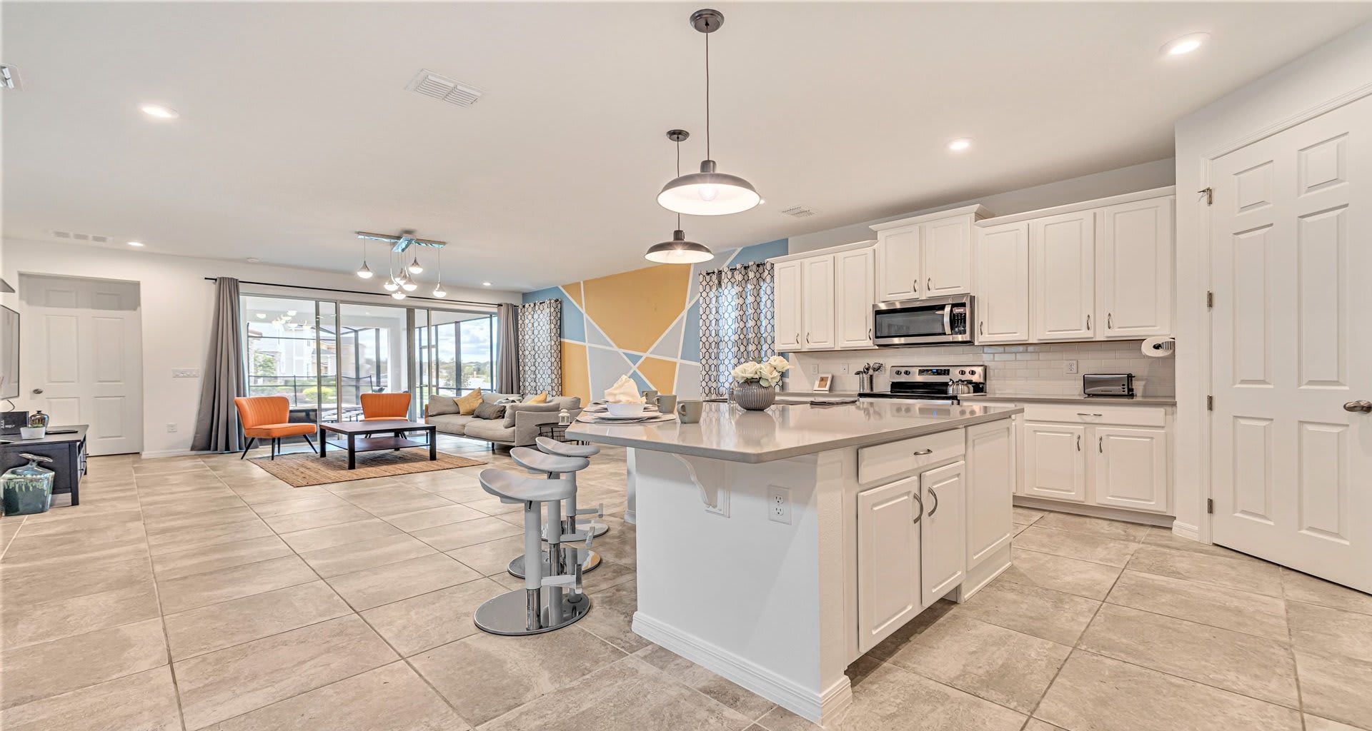 Modern open-concept kitchen and living space with stylish décor and bright vibes! 