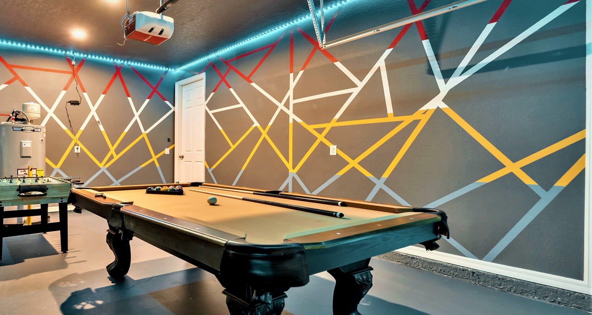 The game room is stylishly furnished with cool lights