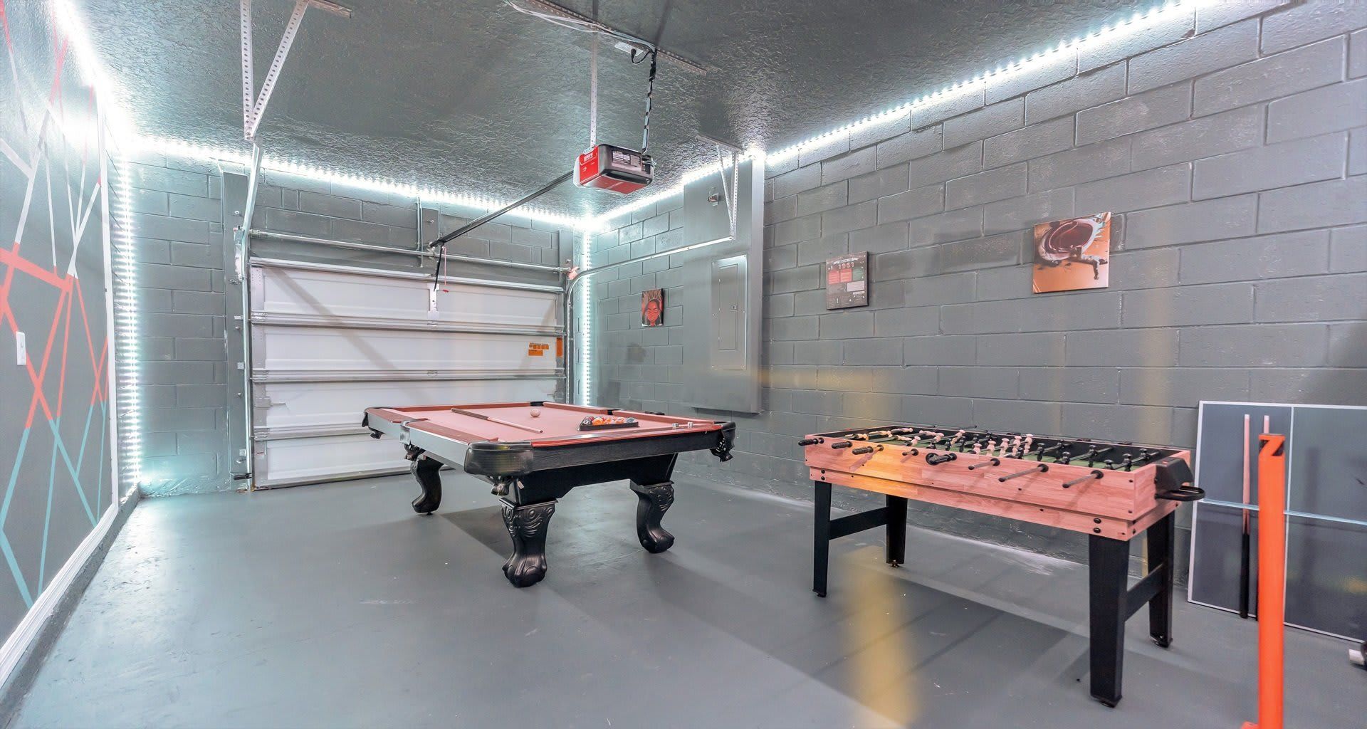 Epic game room with pool, foosball, LED lighting, and a cool modern vibe!