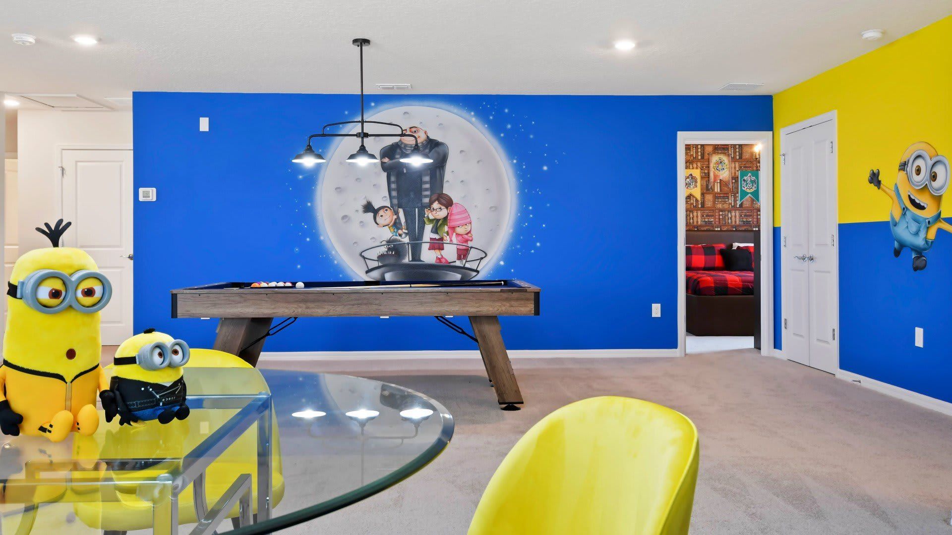 Playful family room with pool table, themed wall art, and cozy seating area!