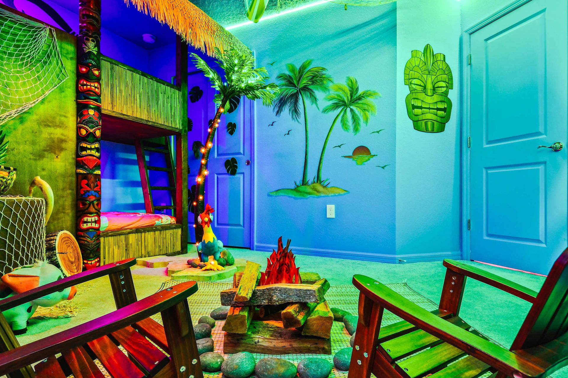 Vibrant island-themed room with tiki bunk beds, palm trees, and a campfire setup!