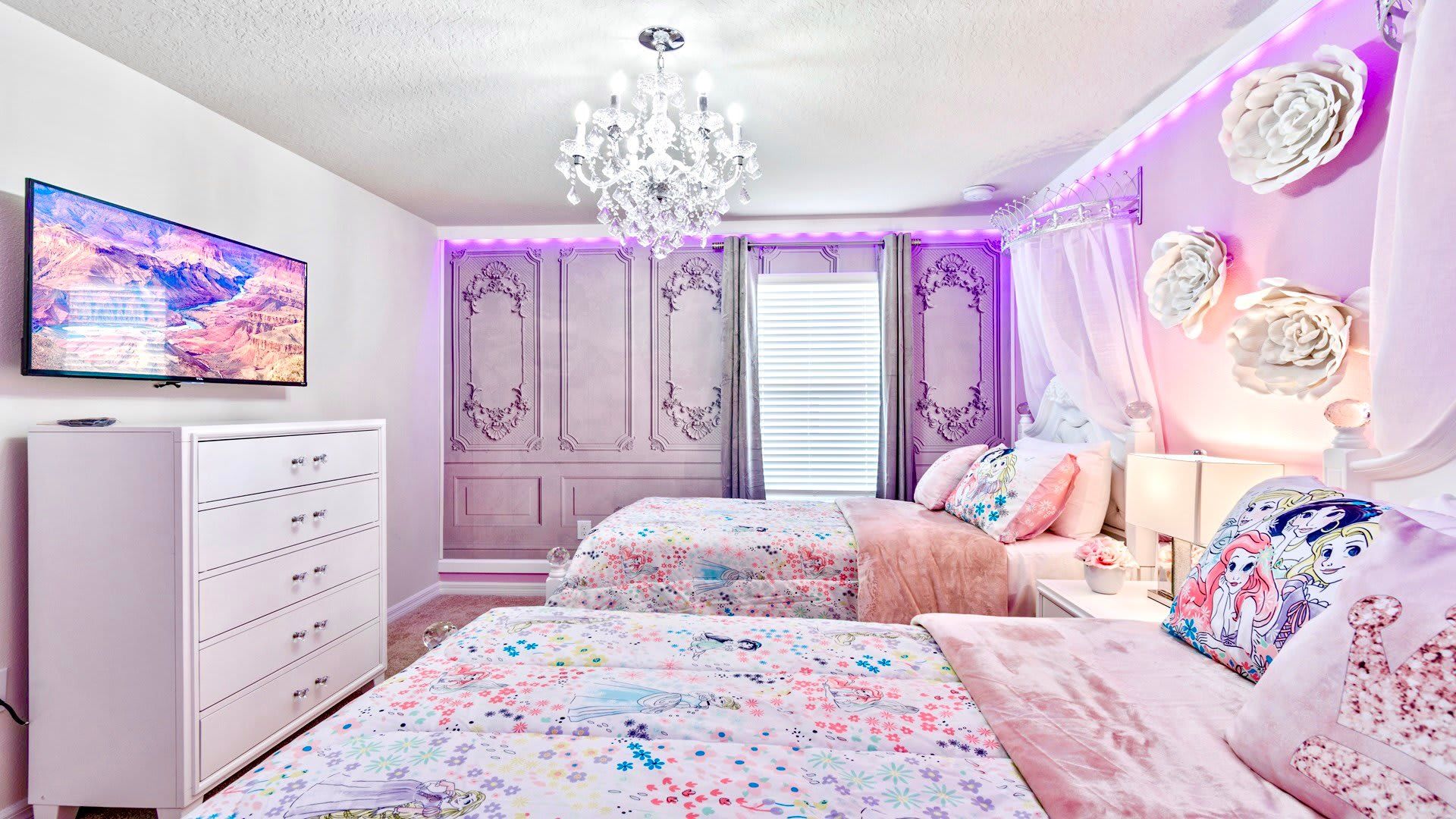 Gorgeous princess themed room with two twin sized beds.