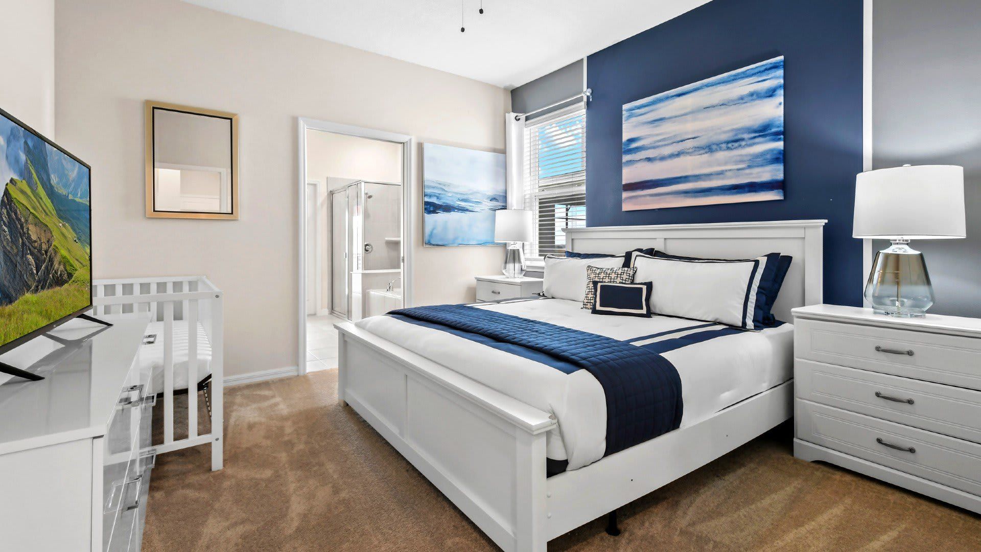 Master bedroom with a baby crib