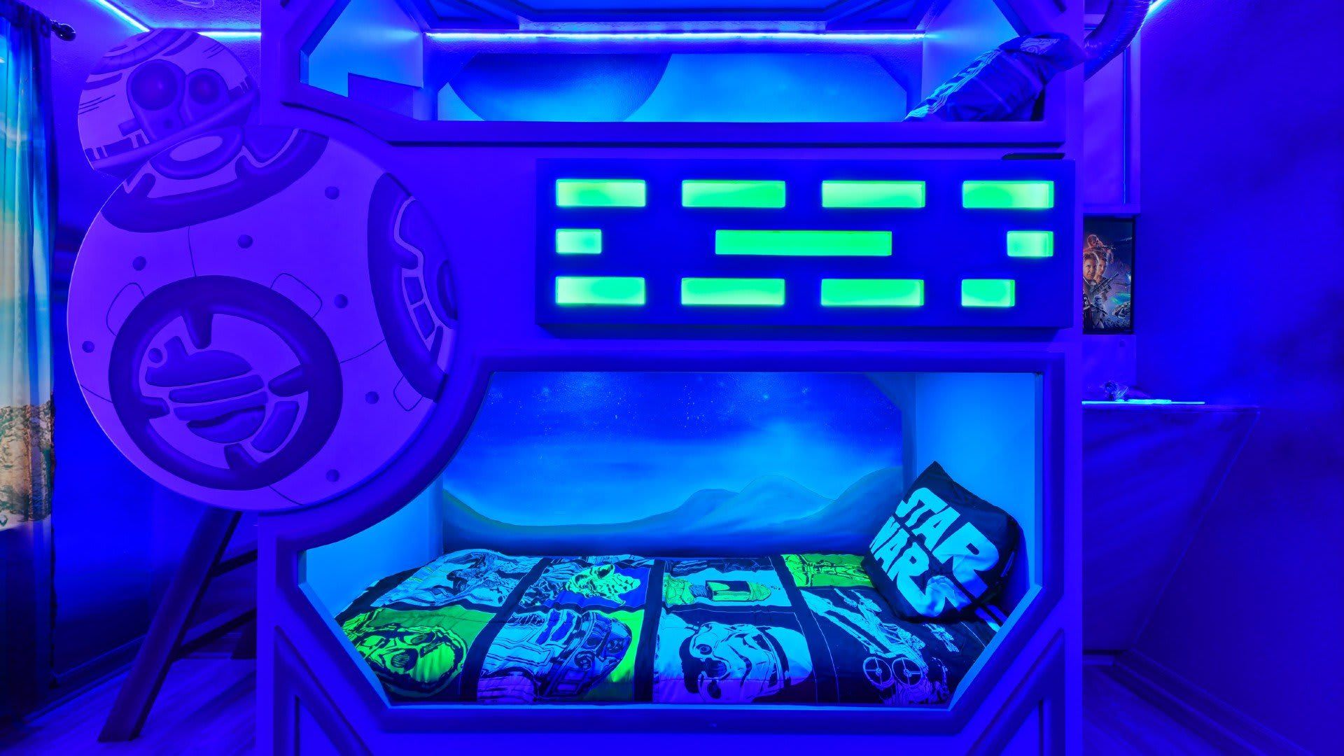 Star wars bunk beds & TV for endless fun in this room.