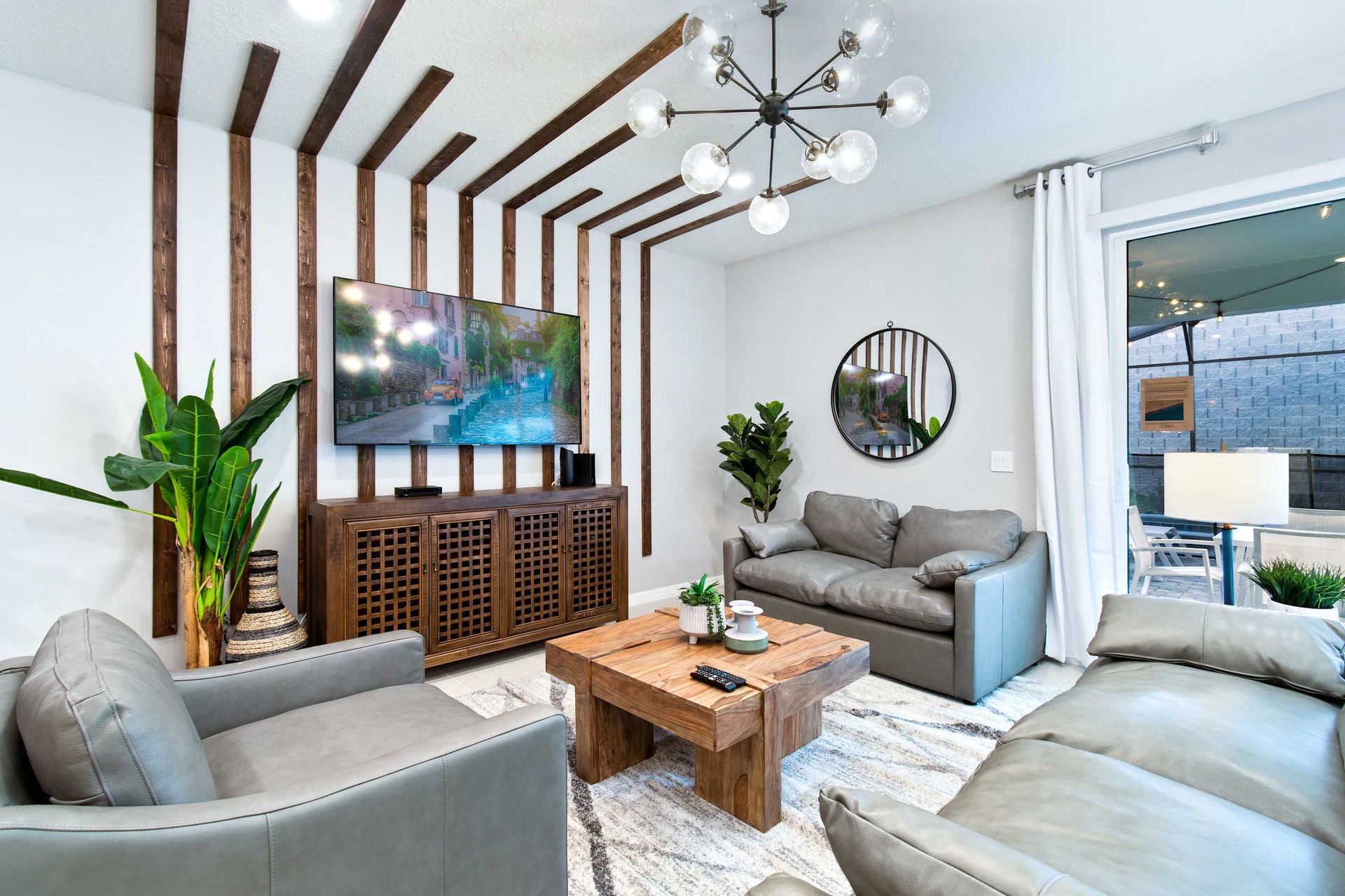 Relax in our modern living room featuring stylish wooden accents and a large flat - screen TV. This cozy and inviting space is perfect for family gathering or unwinding after a day of adventure.