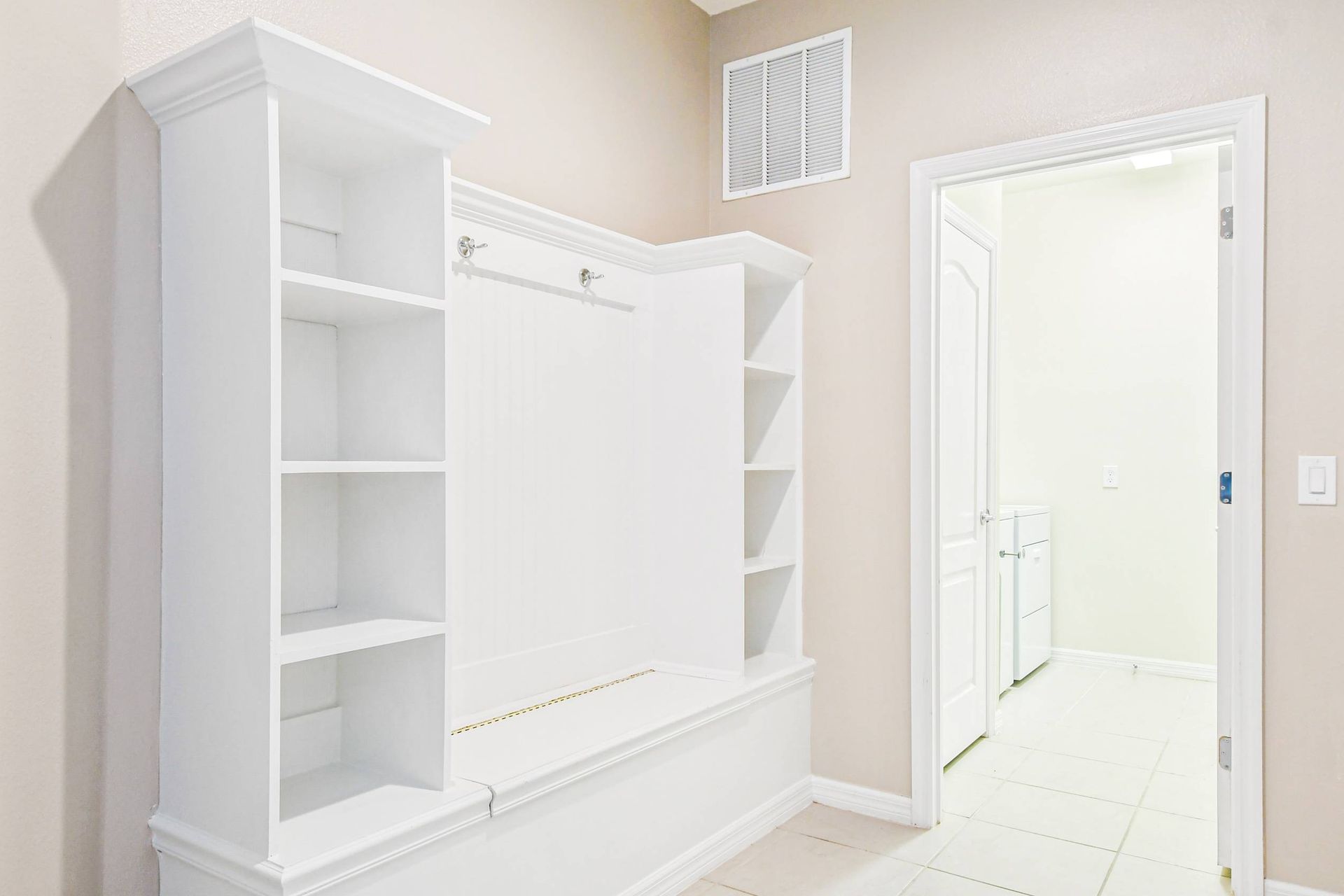 Convenient laundry room with washer, dryer & extra storage for a stress-free stay!