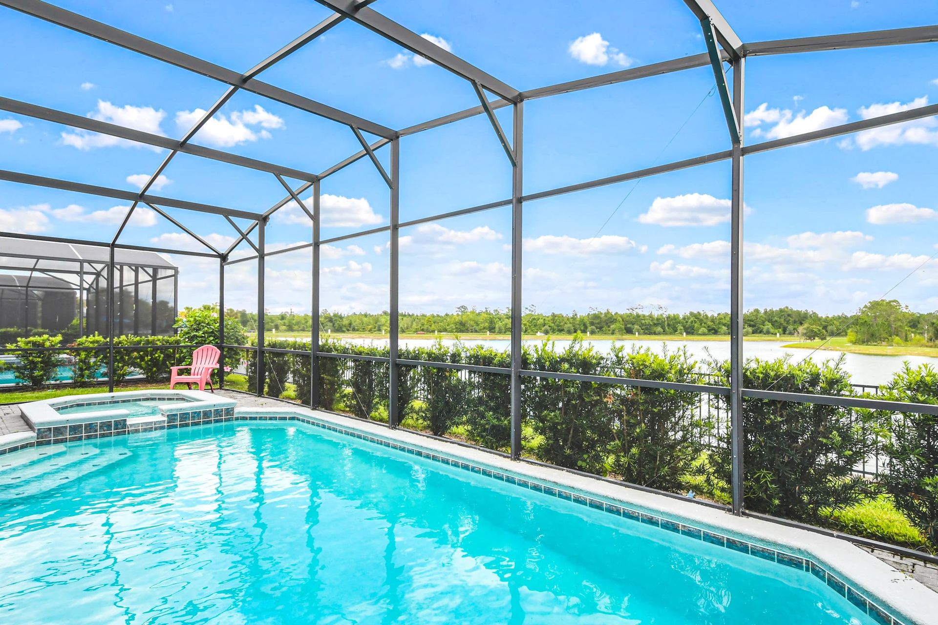 Luxury screened-in pool & spa with lounge seating, dining area & ultimate relaxation!