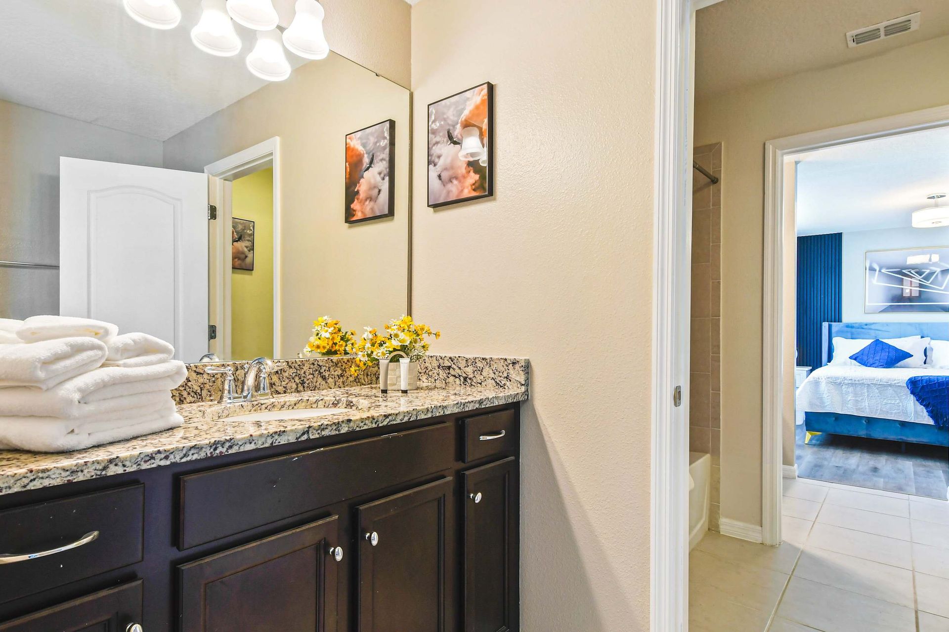 Modern bathroom with dual sinks, granite countertops & a sleek glass walk-in shower!