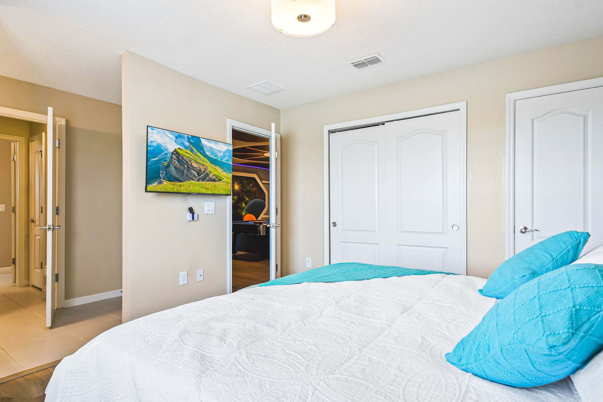 Stylish bedroom with modern decor, cozy bedding & natural light for a serene stay!