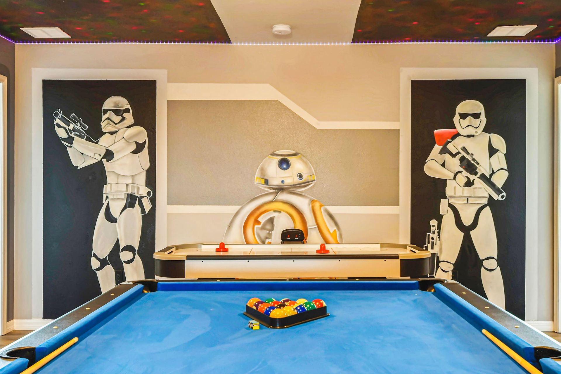 Epic Star Wars-themed game room with pool, air hockey & galactic vibes. Stay in!